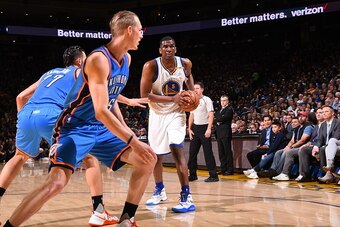 OAKLAND, CA - NOVEMBER 3:  Kevon Looney #5 of the Golden State Warriors handles the ball against the Oklahoma City Thunder on November 3, 2016 at ORACLE Arena in Oakland, California. NOTE TO USER: User expressly acknowledges and agrees that, by downloadin