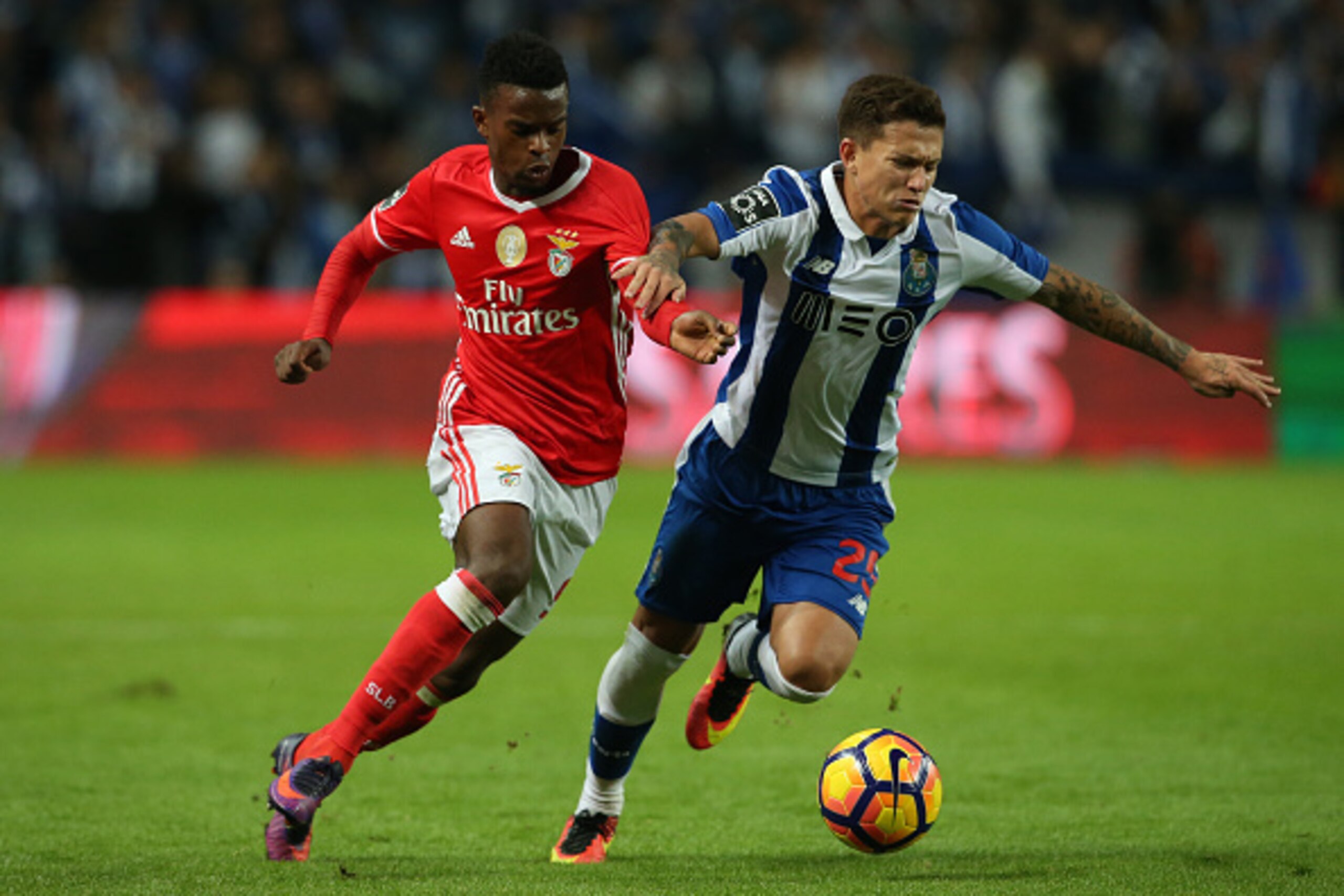 PORTO, PORTUGAL - NOVEMBER 6:  SL Benfica's defender Nelson Semedo (L) with FC Porto's forward from Brazil Otavio (R) in action during the Primeira Liga match between FC Porto and SL Benfica at Estadio do Dragao on November 6, 2016 in Porto, Portugal.  (P