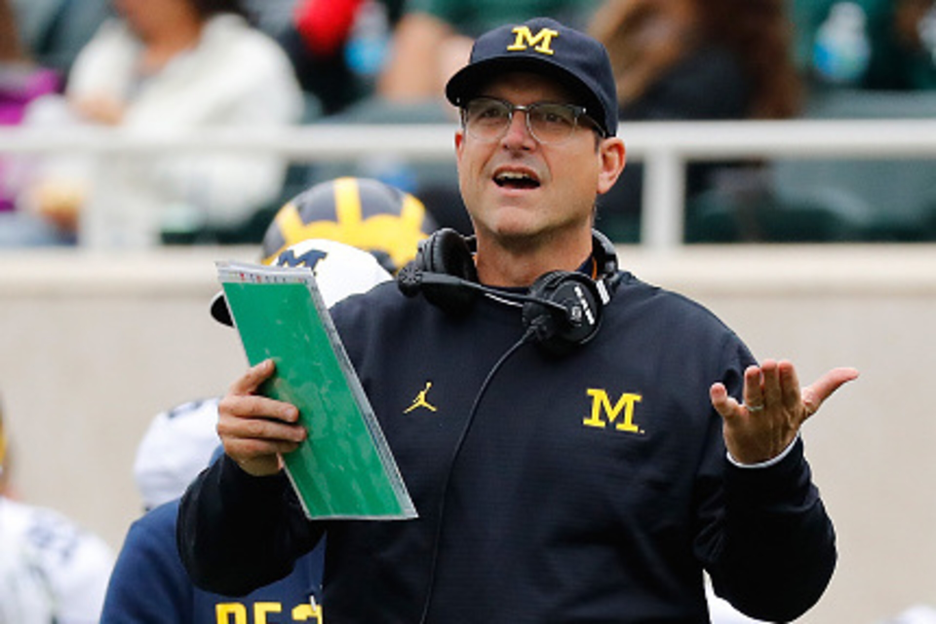 EAST LANSING, MI - OCTOBER 29: Michigan Wolverines head football coach Jim Harbaugh reacts to a call during the third quarter of the game against the Michigan State Spartans at Spartan Stadium on October 29, 2016 in East Lansing, Michigan. Michigan defeat EAST LANSING, MI - OCTOBER 29: Michigan Wolverines head football coach Jim Harbaugh reacts to a call during the third quarter of the game against the Michigan State Spartans at Spartan Stadium on October 29, 2016 in East Lansing, Michigan. Michigan defeat