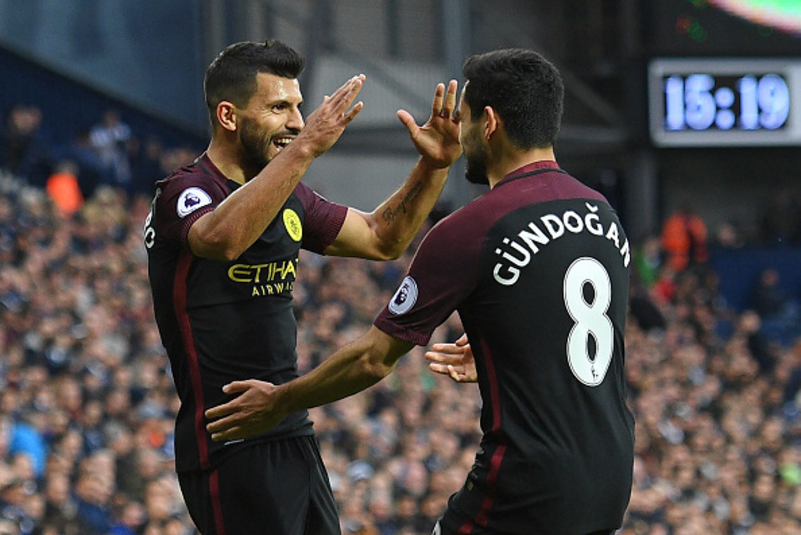 Manchester City's Argentinian striker Sergio Aguero (L) celebrates with Manchester City's German midfielder Ilkay Gundogan after scoring the opening goal of the English Premier League football match between West Bromwich Albion and Manchester City at The 