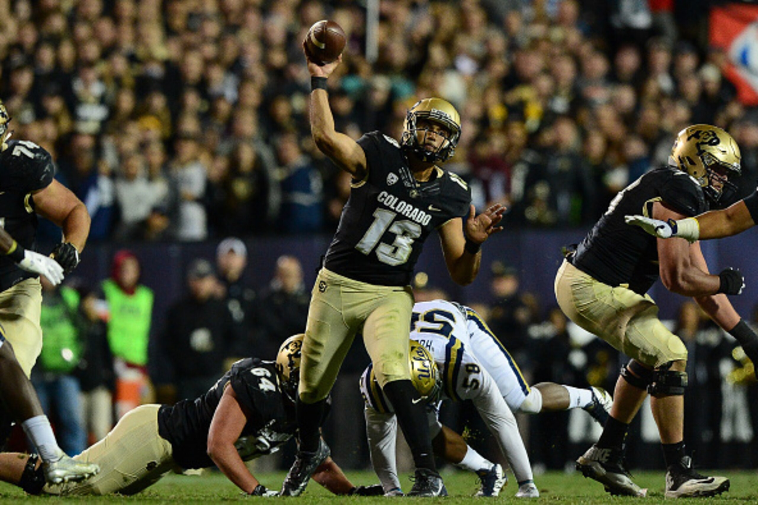 BOULDER, CO - NOVEMBER 3:  Quarterback Sefo Liufau #13 of the Colorado Buffaloes passes against the UCLA Bruins at Folsom Field on November 3, 2016 in Boulder, Colorado.  (Photo by Dustin Bradford/Getty Images)