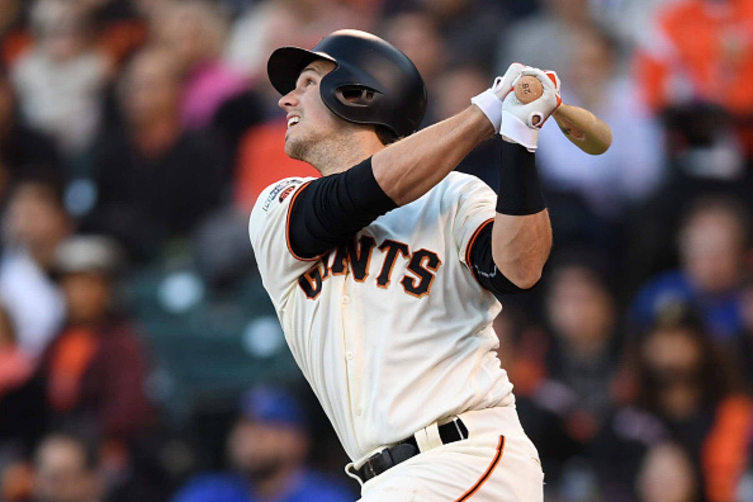 SAN FRANCISCO, CA - OCTOBER 11:  Buster Posey #28 of the San Francisco Giants hits a sacrifice fly scoring Denard Span #2 during Game Four of their National League Division Series against the Chicago Cubs at AT&T Park on October 11, 2016 in San Francisco,