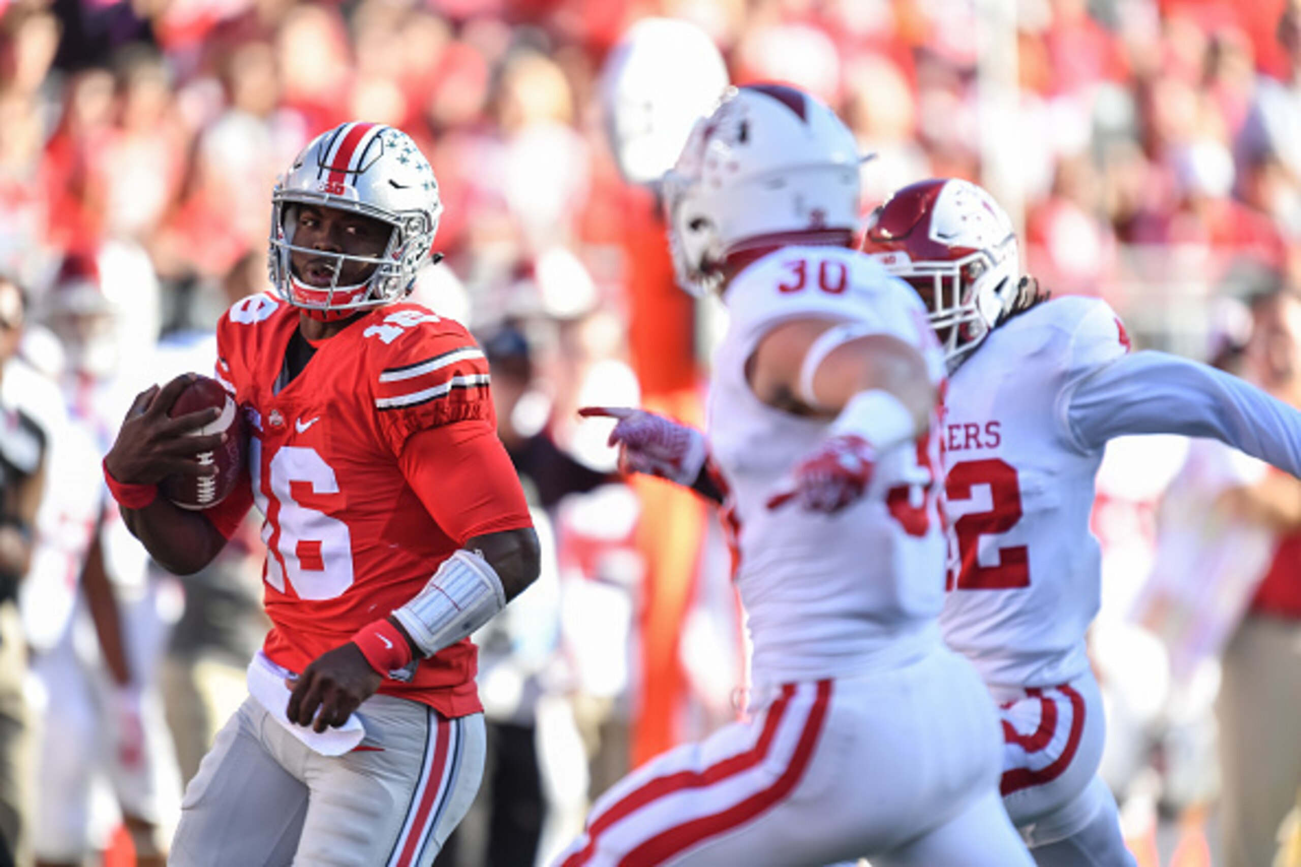 COLUMBUS, OH - OCTOBER 8: Quarterback J.T. Barrett #16 of the Ohio State Buckeyes runs with the ball against the Indiana Hoosiers at Ohio Stadium on October 8, 2016 in Columbus, Ohio. Ohio State defeated Indiana 38-17. (Photo by Jamie Sabau/Getty Images COLUMBUS, OH - OCTOBER 8: Quarterback J.T. Barrett #16 of the Ohio State Buckeyes runs with the ball against the Indiana Hoosiers at Ohio Stadium on October 8, 2016 in Columbus, Ohio. Ohio State defeated Indiana 38-17. (Photo by Jamie Sabau/Getty Images
