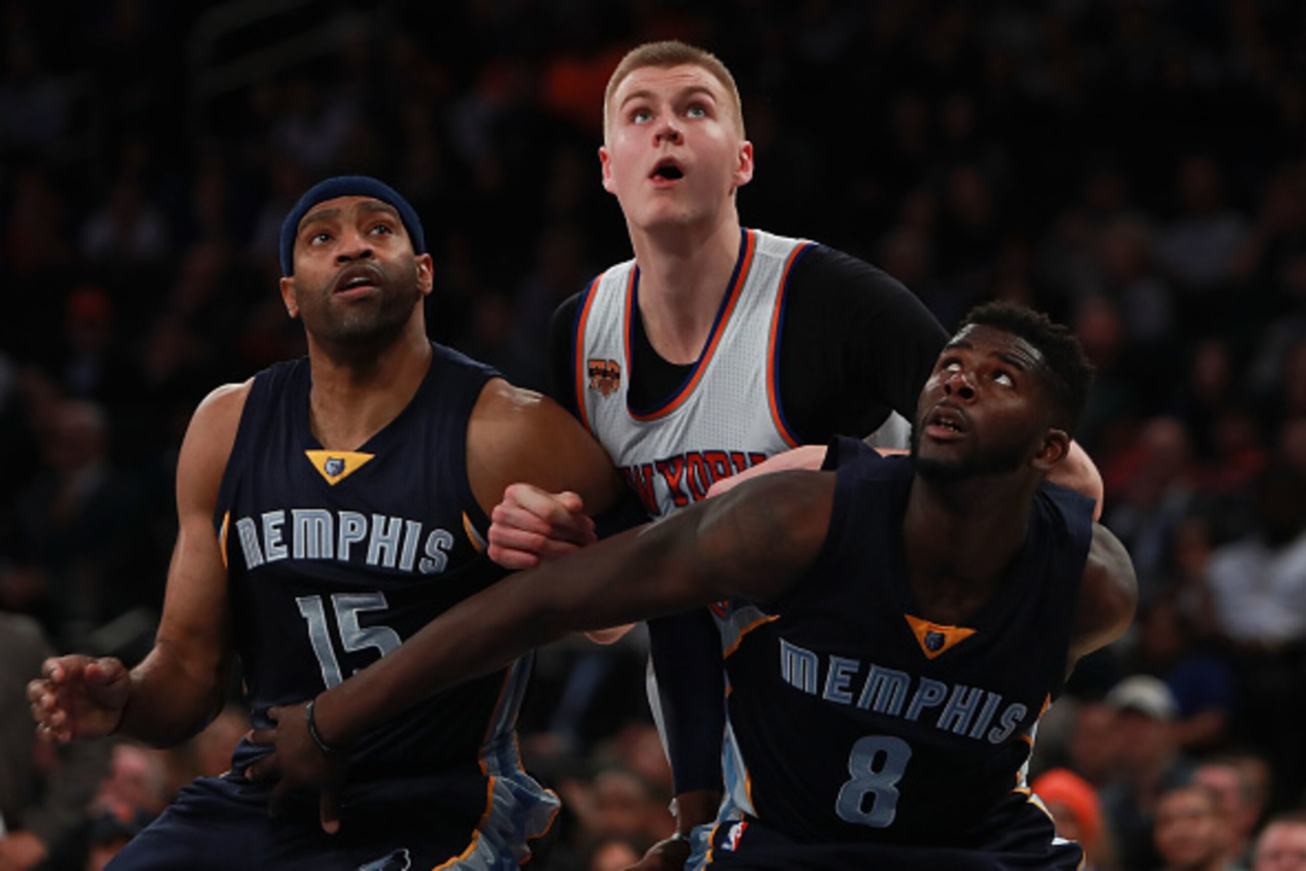 NEW YORK, NY - OCTOBER 29:  Kristaps Porzingis #6 of the New York Knicks fights for a rebound with Vince Carter #15 and James Ennis #8 of the Memphis Grizzlies during the second half at Madison Square Garden on October 29, 2016 in New York City. NOTE TO U