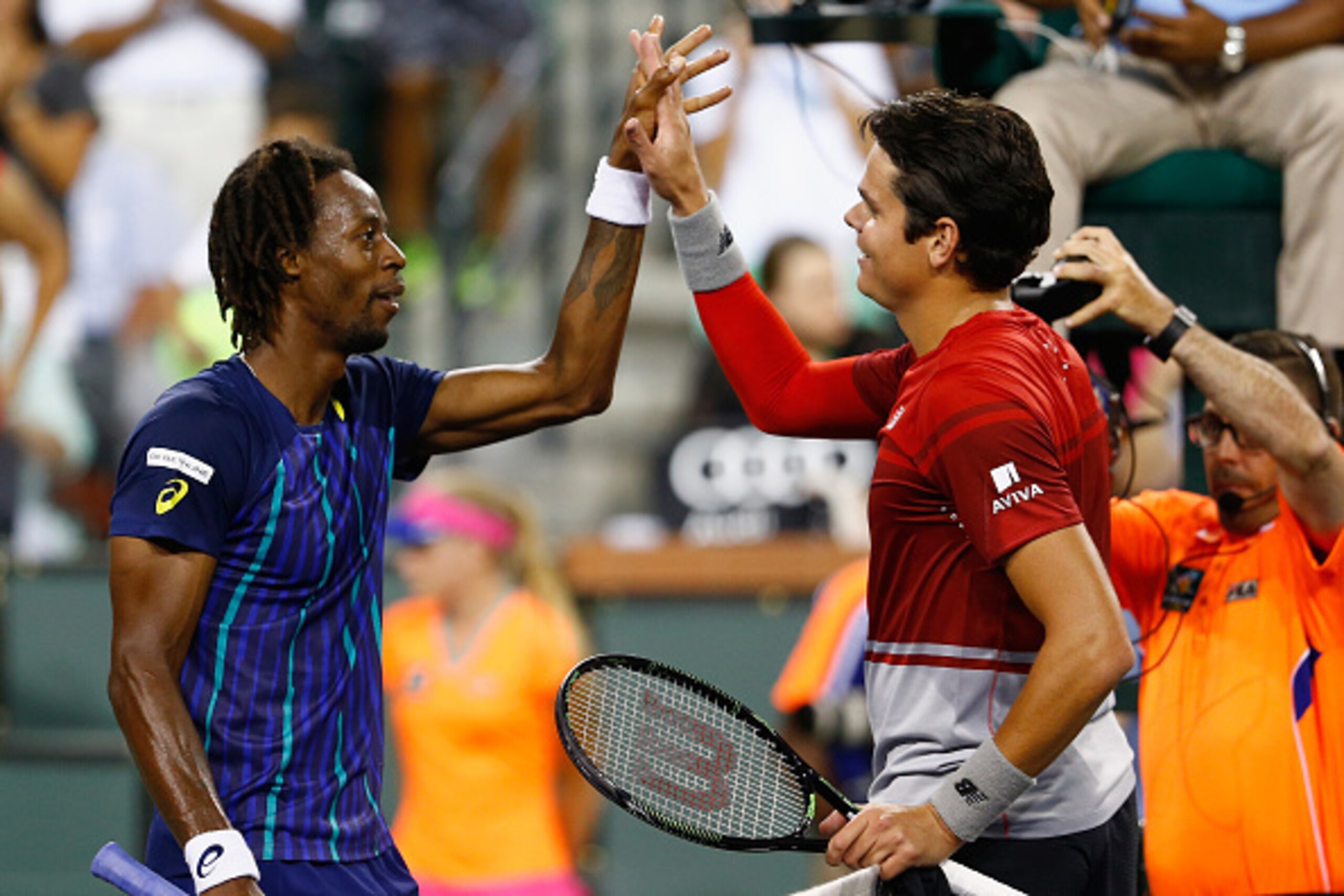 INDIAN WELLS, CA - MARCH 17:  Milos Raonic of Canada is congratulated by Gael Monfils of France after his straight sets win during day eleven of the BNP Paribas Open at Indian Wells Tennis Garden on March 17, 2016 in Indian Wells, California.  (Photo by J