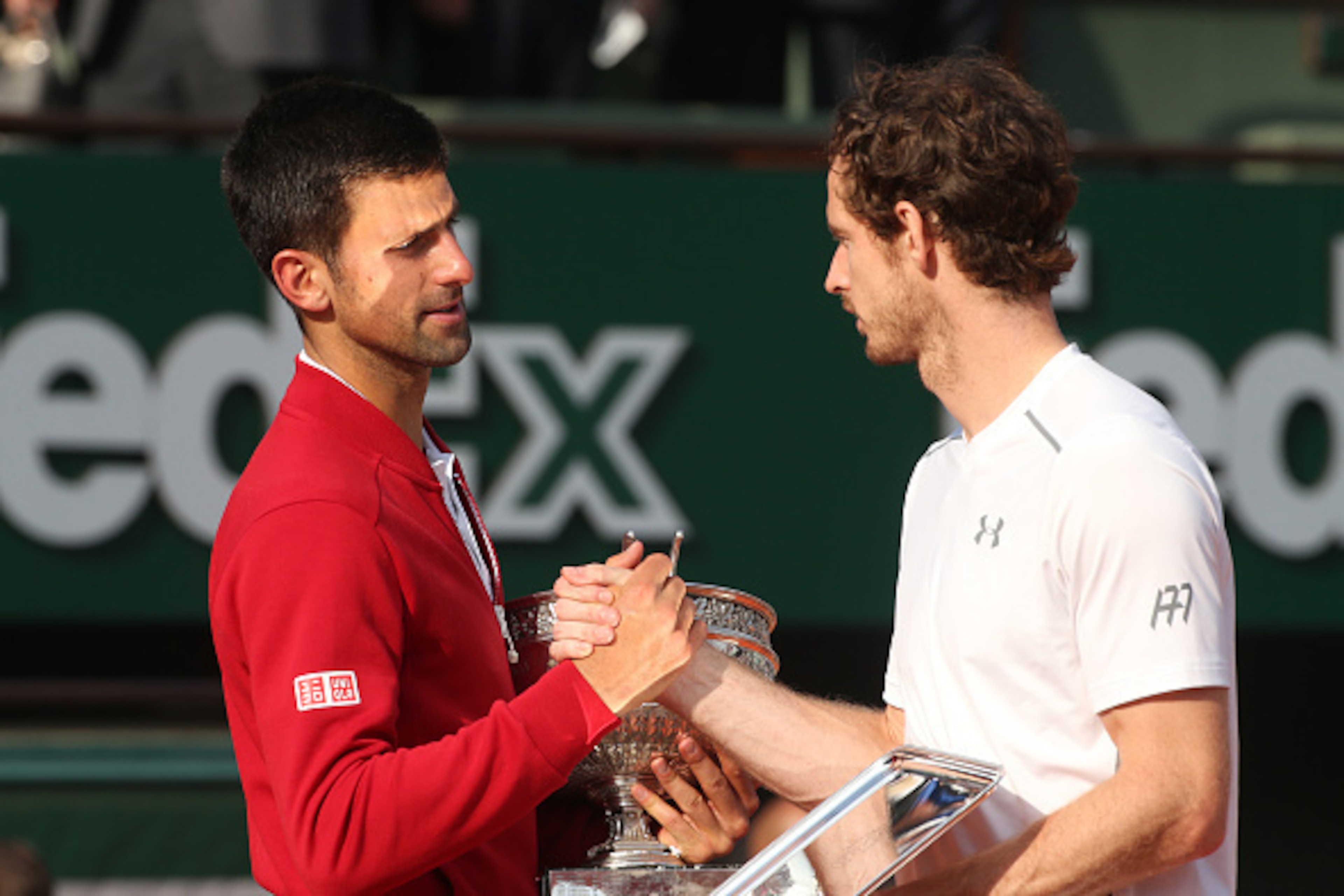 PARIS, FRANCE - JUNE 5: Winner Novak Djokovic of Serbia greets finalist Andy Murray of Great Britain during the trophy ceremony following the Men's Singles final match on day fifteen of the 2016 French Open at Roland-Garros stadium on June 5, 2016 in Pari