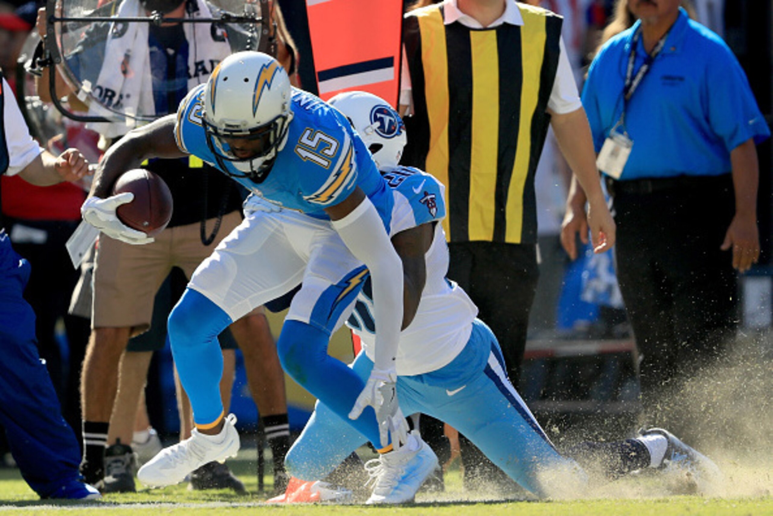 SAN DIEGO, CA - NOVEMBER 06:   Dontrelle Inman #15 of the San Diego Chargers drags  Perrish Cox #20 of the Tennessee Titans to make a first down in the first half at Qualcomm Stadium on November 6, 2016 in San Diego, California.  (Photo by Sean M. Haffey/