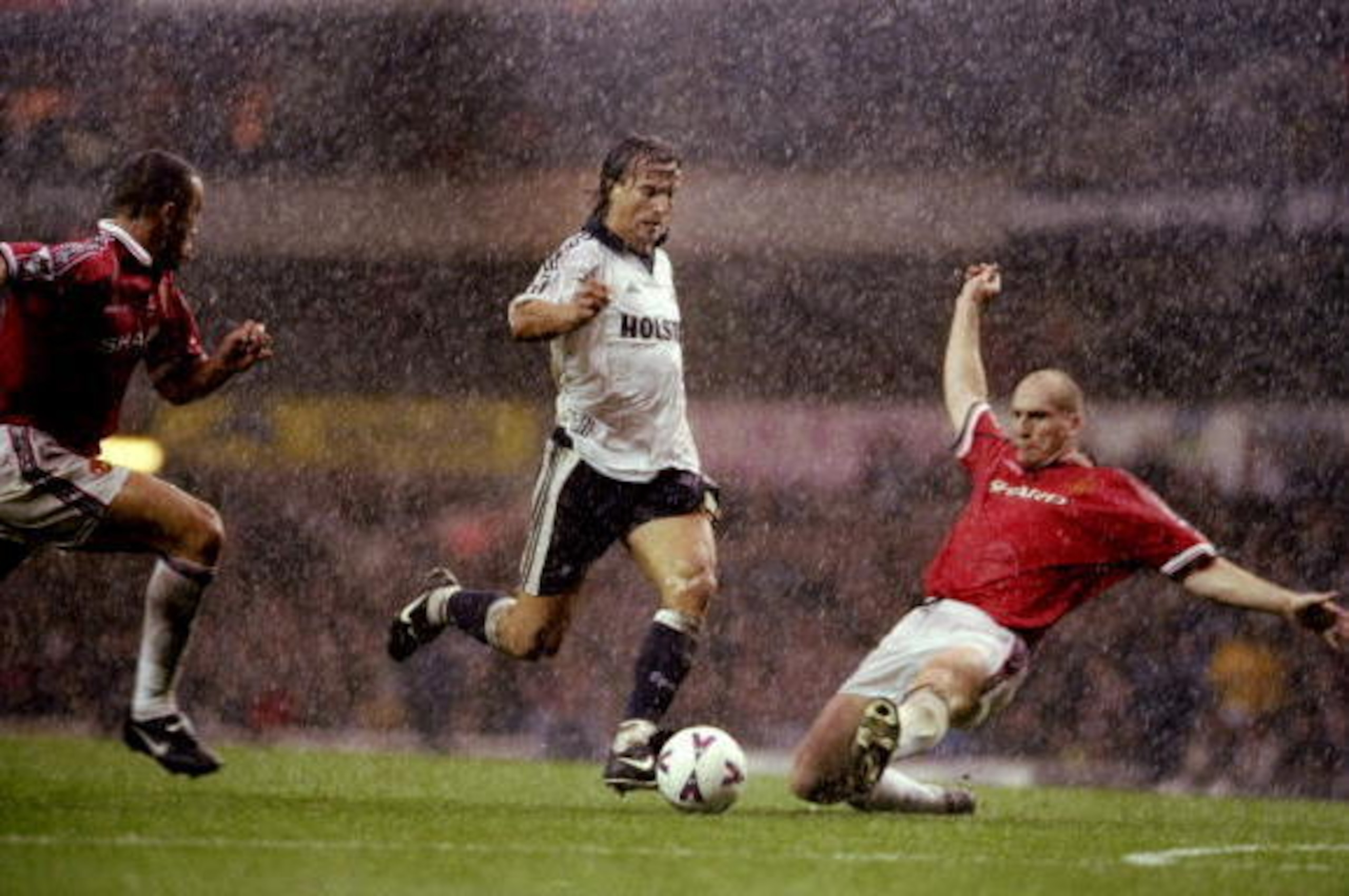 23 Oct 1999:  David Ginola of Tottenham Hotspur takes on Jaap Stam of Manchester United during the FA Carling Premiership match at White Hart Lane in London. Spurs won 3-1. \ Mandatory Credit: Clive Brunskill /Allsport