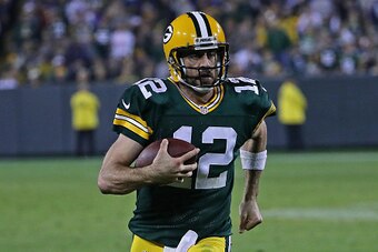 GREEN BAY, WI - NOVEMBER 06:  Aaron Rodgers #12 of the Green Bay Packers runs for a first down in the 4th quarter against the Indianapolis Colts at Lambeau Field on November 6, 2016 in Green Bay, Wisconsin. The Colts defeated the Packers 31-26.  (Photo by