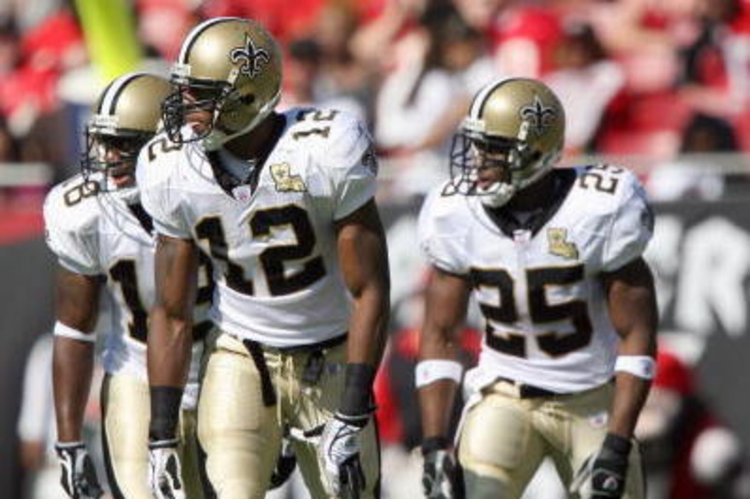 TAMPA, FL - NOVEMBER 5:  Marques Colston #12 Terrance Copper #18 Reggie Bush #25 of the New Orleans Saints gets ready to move at the snap during the game against the Tampa Bay Buccaneers on November 5, 2006 at Raymond James Stadium in Tampa, Florida. The 