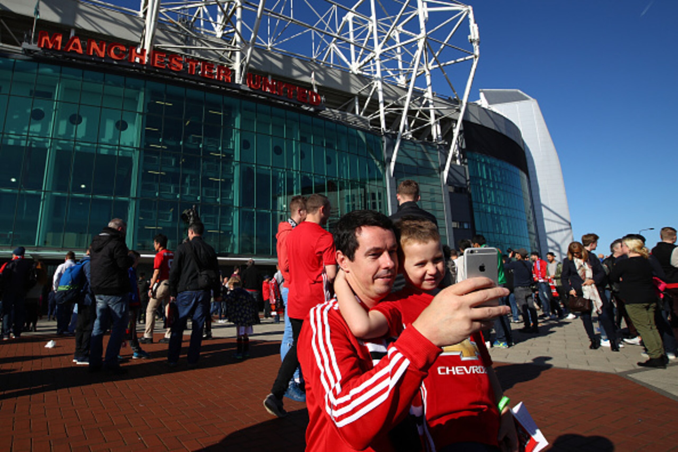 MANCHESTER, ENGLAND - OCTOBER 02:  Two fans take a selfie outside the stadium prior to kick off during the Premier League match between Manchester United and Stoke City at Old Trafford on October 2, 2016 in Manchester, England.  (Photo by Clive Brunskill/