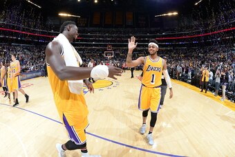 LOS ANGELES, CA - NOVEMBER 4: Julius Randle #30 and D'Angelo Russell #1 of the Los Angeles Lakers celebrate after the game against the Golden State Warriors on November 4, 2016 at STAPLES Center in Los Angeles, California. NOTE TO USER: User expressly ack