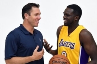 Sep 26, 2016; Los Angeles, CA, USA; Los Angeles Lakers coach Luke Walton (left) and forward Luol Deng (9) at media day at Toyota Sports Center.. Mandatory Credit: Kirby Lee-USA TODAY Sports