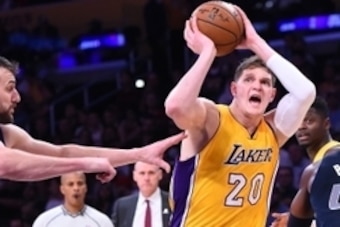 Nov 8, 2016; Los Angeles, CA, USA;  Los Angeles Lakers center Timofey Mozgov (20) drives to the basket past Dallas Mavericks center Andrew Bogut (6) in the second half of the game at Staples Center. Mavericks won 109-97. Mandatory Credit: Jayne Kamin-Once