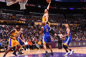 LOS ANGELES, CA - NOVEMBER 4: Larry Nance Jr. #7 of the Los Angeles Lakers dunks against the Golden State Warriors on November 4, 2016 at STAPLES Center in Los Angeles, California. NOTE TO USER: User expressly acknowledges and agrees that, by downloading