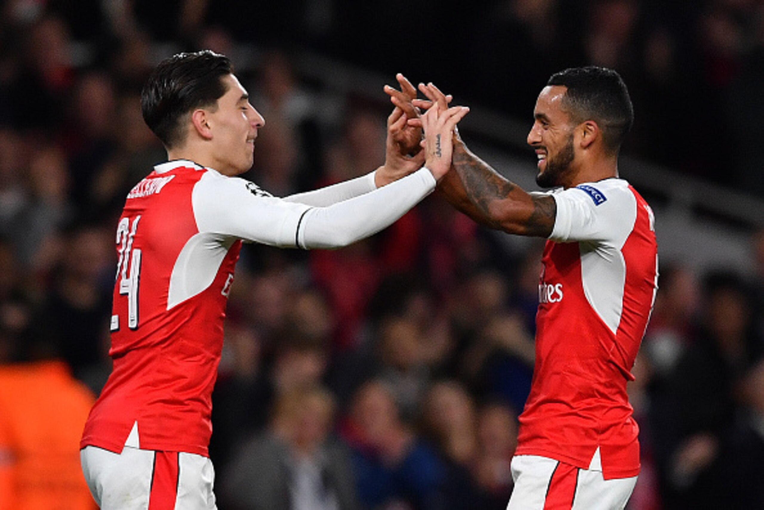 Arsenal's English midfielder Theo Walcott (R) celebrates scoring his team's second goal with Arsenal's Spanish defender Hector Bellerin during the UEFA Champions League Group A football match between Arsenal and Ludogorets Razgrad at The Emirates Stadium 