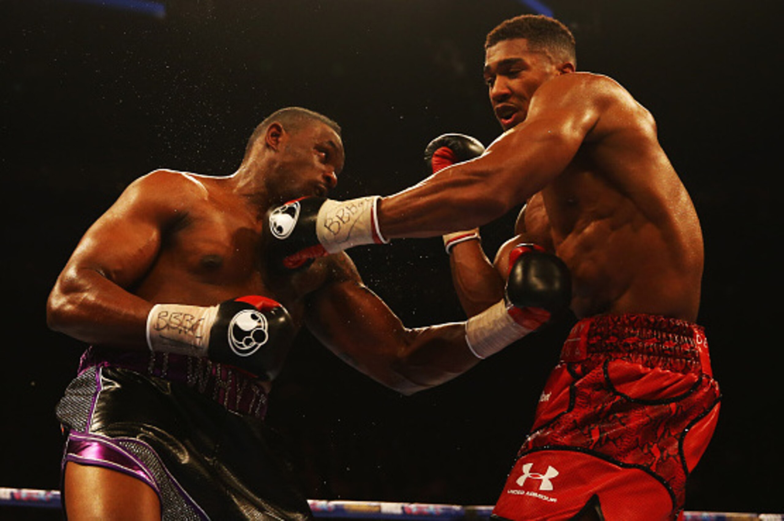 LONDON, ENGLAND - DECEMBER 12:  Anthony Joshua (R) and Dillian Whyte in action during the British and Commonwealth heavyweight title contest at The O2 Arena on December 12, 2015 in London, England.  (Photo by Richard Heathcote/Getty Images)