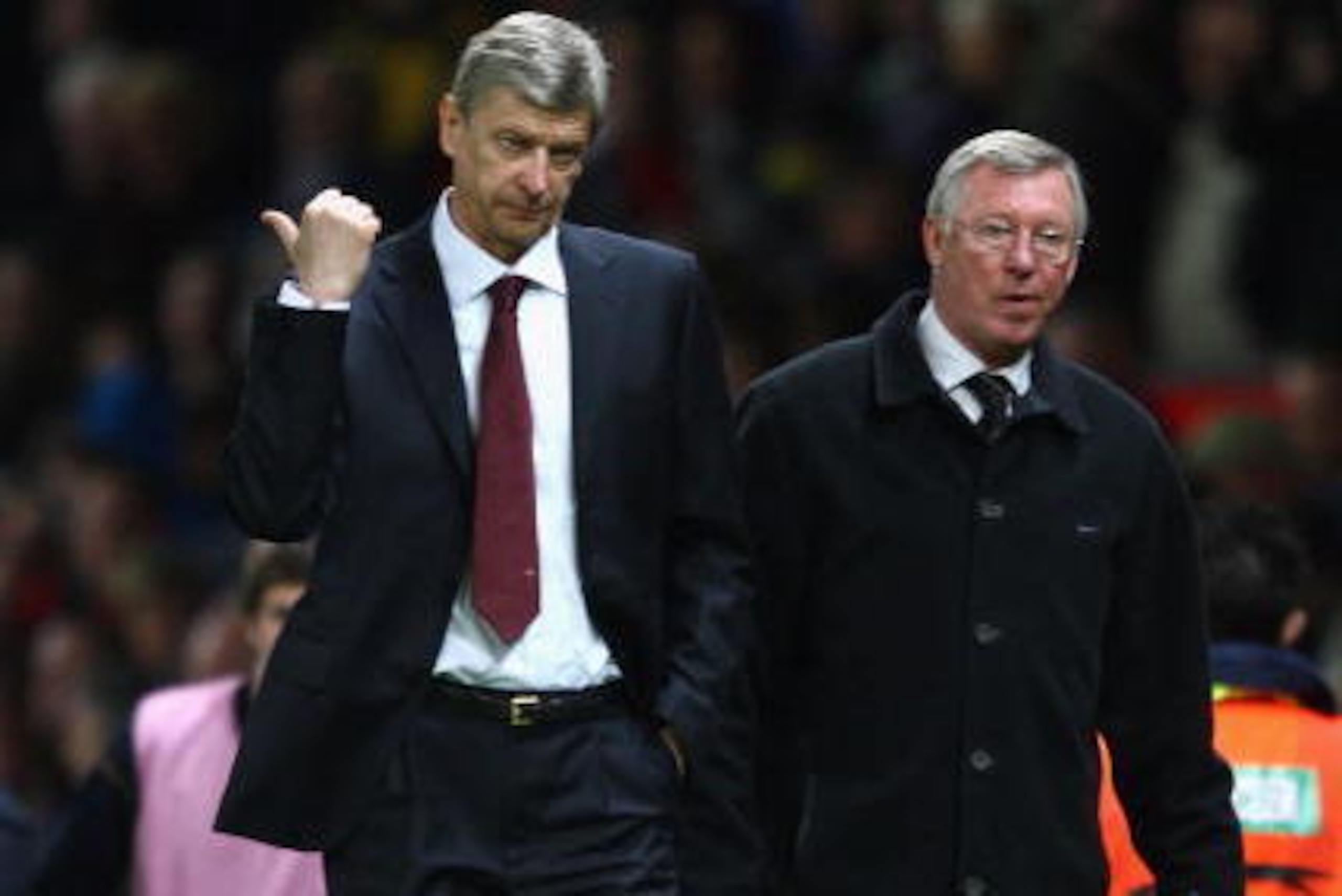 MANCHESTER, UNITED KINGDOM - APRIL 29:   Arsenal Manager Arsene Wenger gestures as he walks off with Manchester United Manager Sir Alex Ferguson at the end of the UEFA Champions League Semi Final First Leg match between Manchester United and Arsenal at Ol