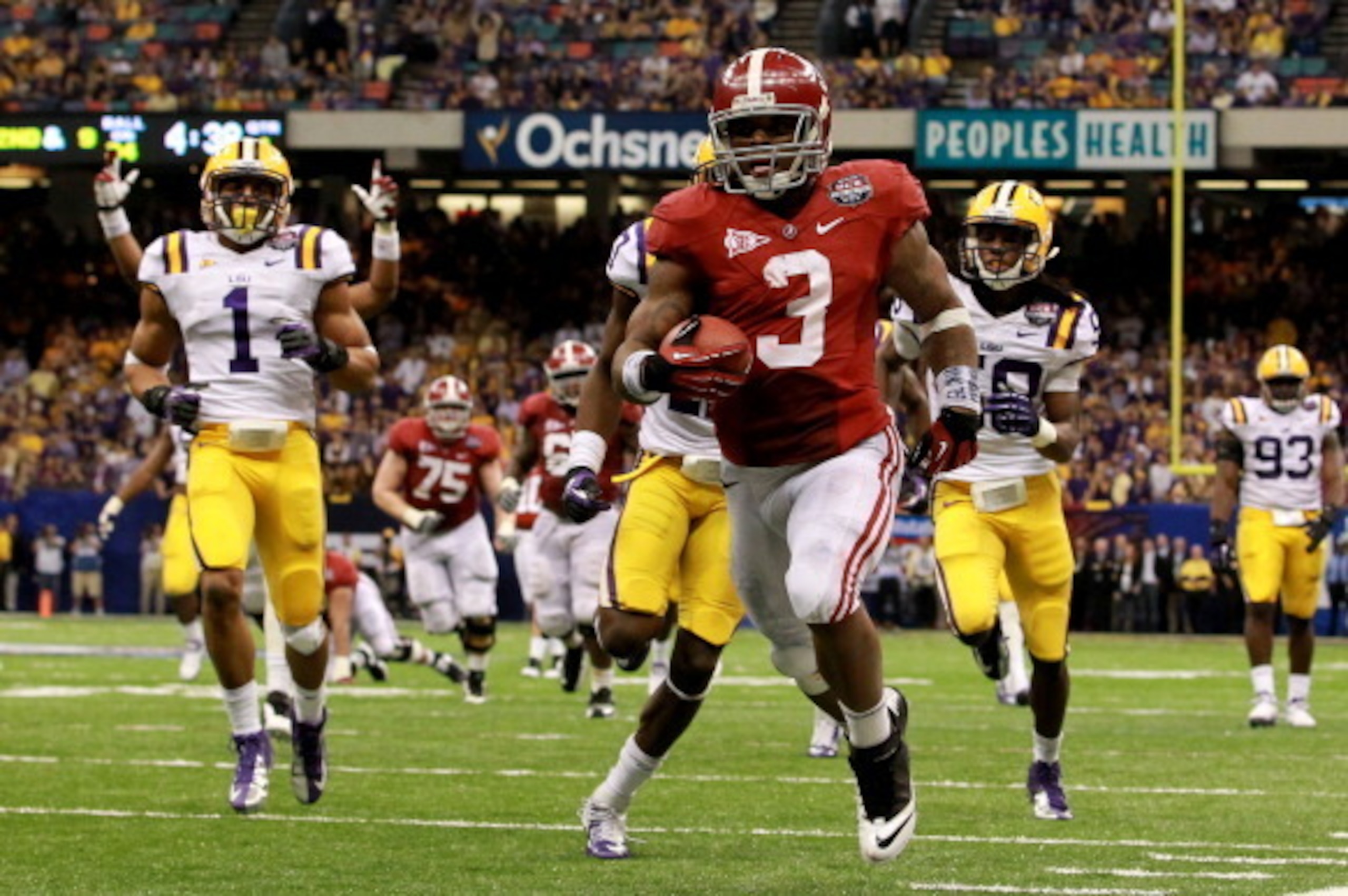 NEW ORLEANS, LA - JANUARY 09:  Trent Richardson #3 of the Alabama Crimson Tide runs for a 34 yard touchdown in the fourth quarter against Morris Claiborne #17 of the Louisiana State University Tigers during the 2012 Allstate BCS National Championship Game