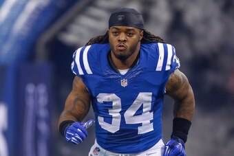 INDIANAPOLIS, IN - DECEMBER  14: Trent Richardson #34 of the Indianapolis Colts takes the field during player introductions before the game against the Houston Texans at Lucas Oil Stadium on December 14, 2014 in Indianapolis, Indiana. (Photo by Michael Hi