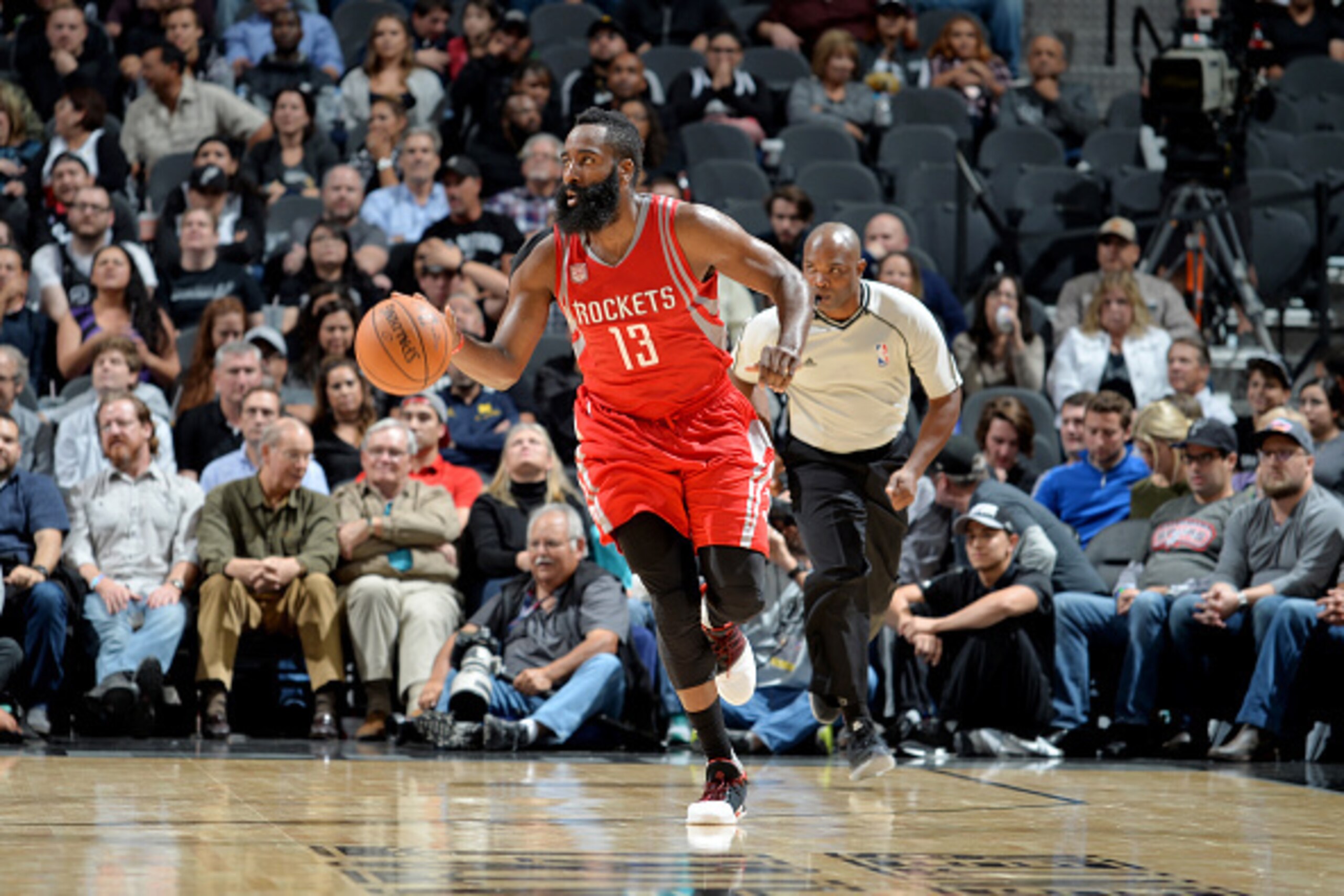 SAN ANTONIO, TX - NOVEMBER 9: James Harden #13 of the Houston Rockets drives to the basket against the San Antonio Spurs during the game on November 9, 2016 at the AT&T Center in San Antonio, Texas. Harden recorded his 10th career triple-double in the Ro SAN ANTONIO, TX - NOVEMBER 9: James Harden #13 of the Houston Rockets drives to the basket against the San Antonio Spurs during the game on November 9, 2016 at the AT&T Center in San Antonio, Texas. Harden recorded his 10th career triple-double in the Ro