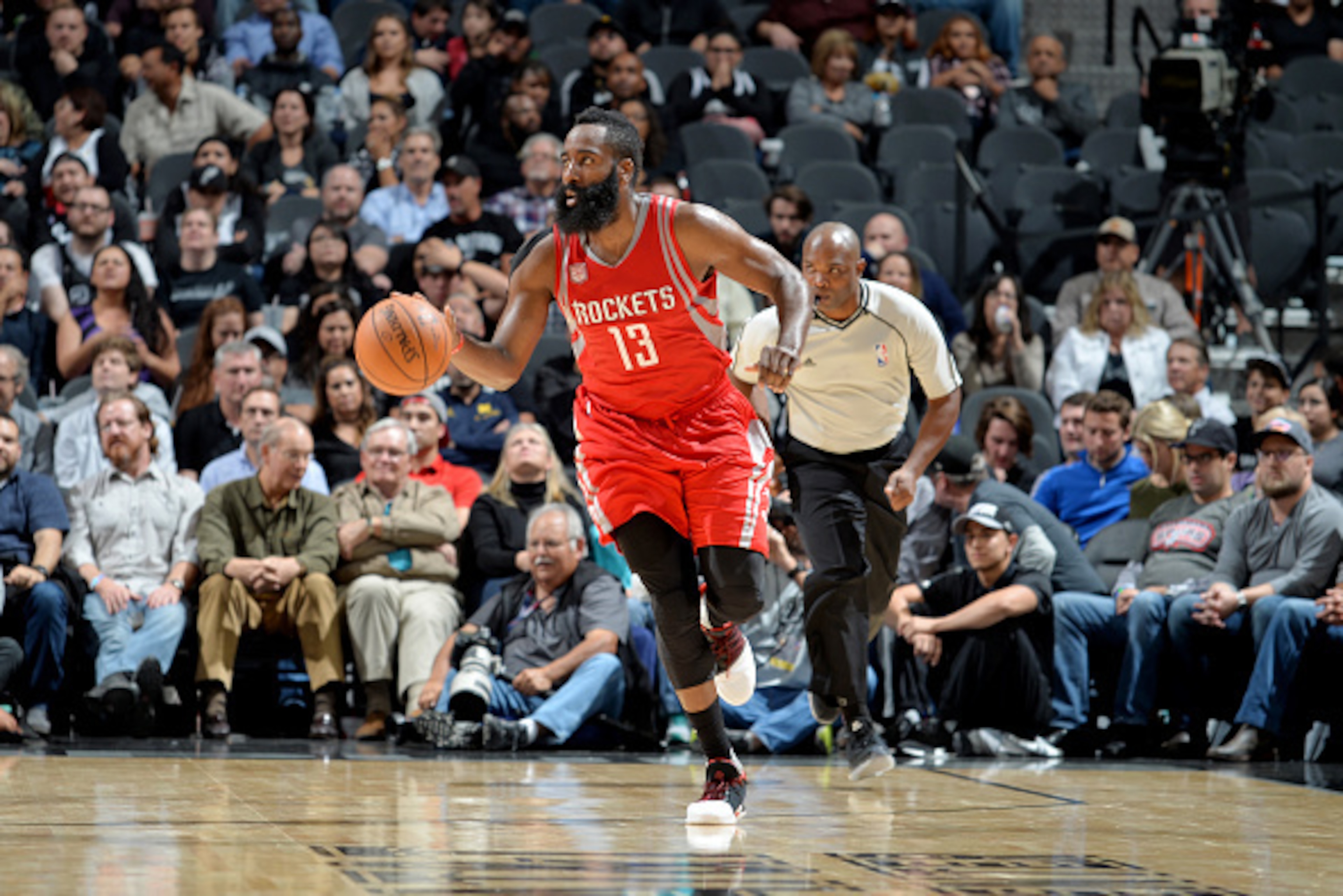 SAN ANTONIO, TX - NOVEMBER 9:  James Harden #13 of the Houston Rockets drives to the basket against the San Antonio Spurs during the game on November 9, 2016 at the AT&T Center in San Antonio, Texas. Harden recorded his 10th career triple-double in the Ro