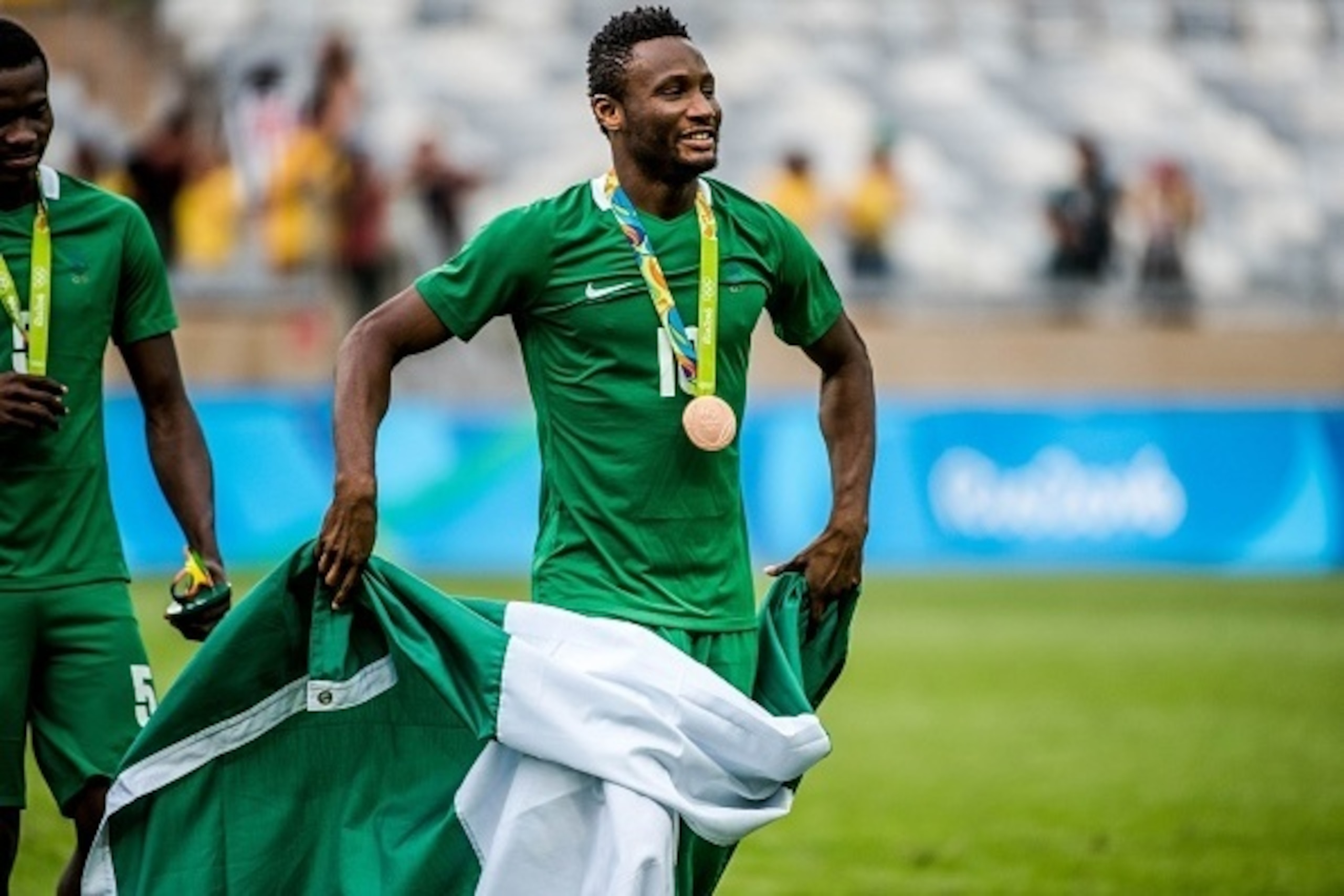 Nigeria's John Obi Mikel celebrates after receiving the bronze medal during the medal ceremony after defeating Honduras in the Rio 2016 Olympic Games men's bronze medal football match at the Mineirao stadium in Belo Horizonte, Brazil, on August 20, 2016. 