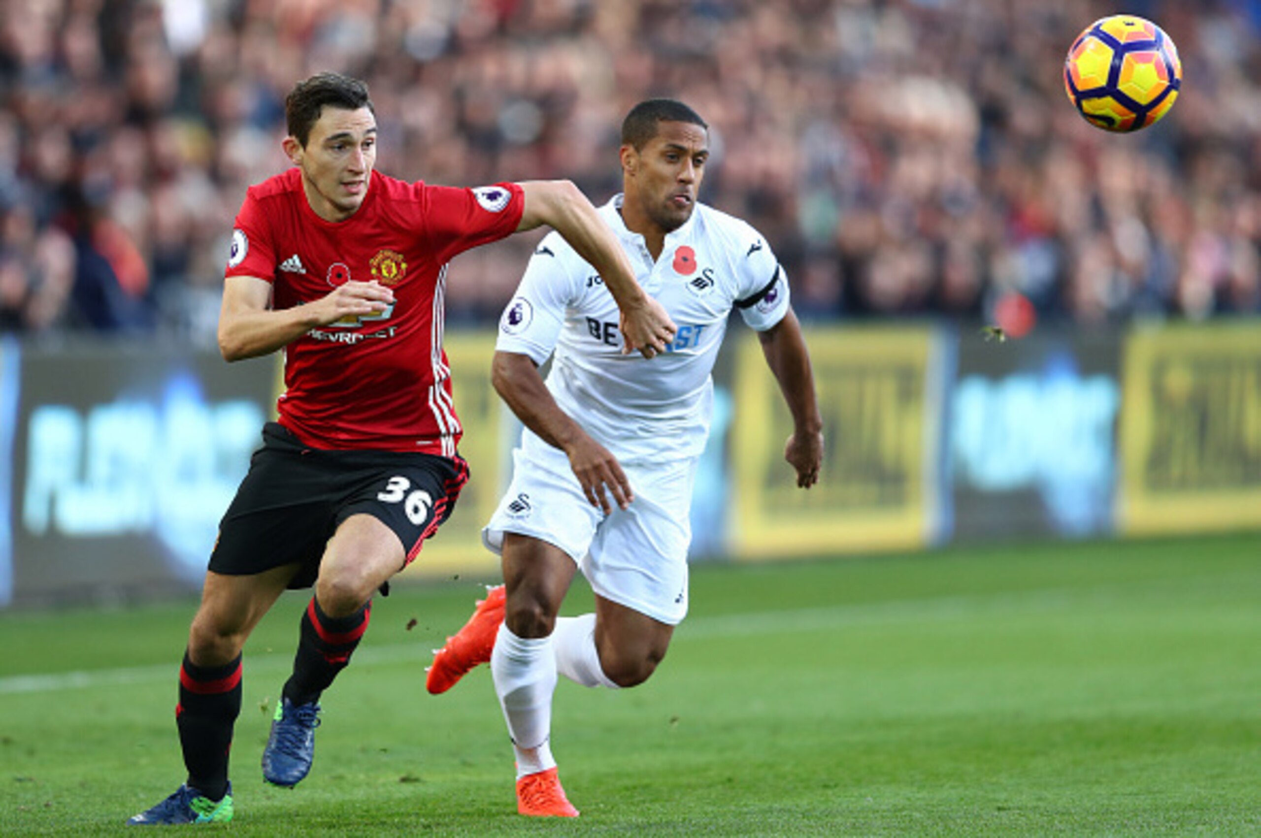 SWANSEA, WALES - NOVEMBER 06: Wayne Routledge of Swansea City and Matteo Darmian of Manchester United chase the ball during the Premier League match between Swansea City and Manchester United at Liberty Stadium on November 6, 2016 in Swansea, Wales. (Ph SWANSEA, WALES - NOVEMBER 06: Wayne Routledge of Swansea City and Matteo Darmian of Manchester United chase the ball during the Premier League match between Swansea City and Manchester United at Liberty Stadium on November 6, 2016 in Swansea, Wales. (Ph