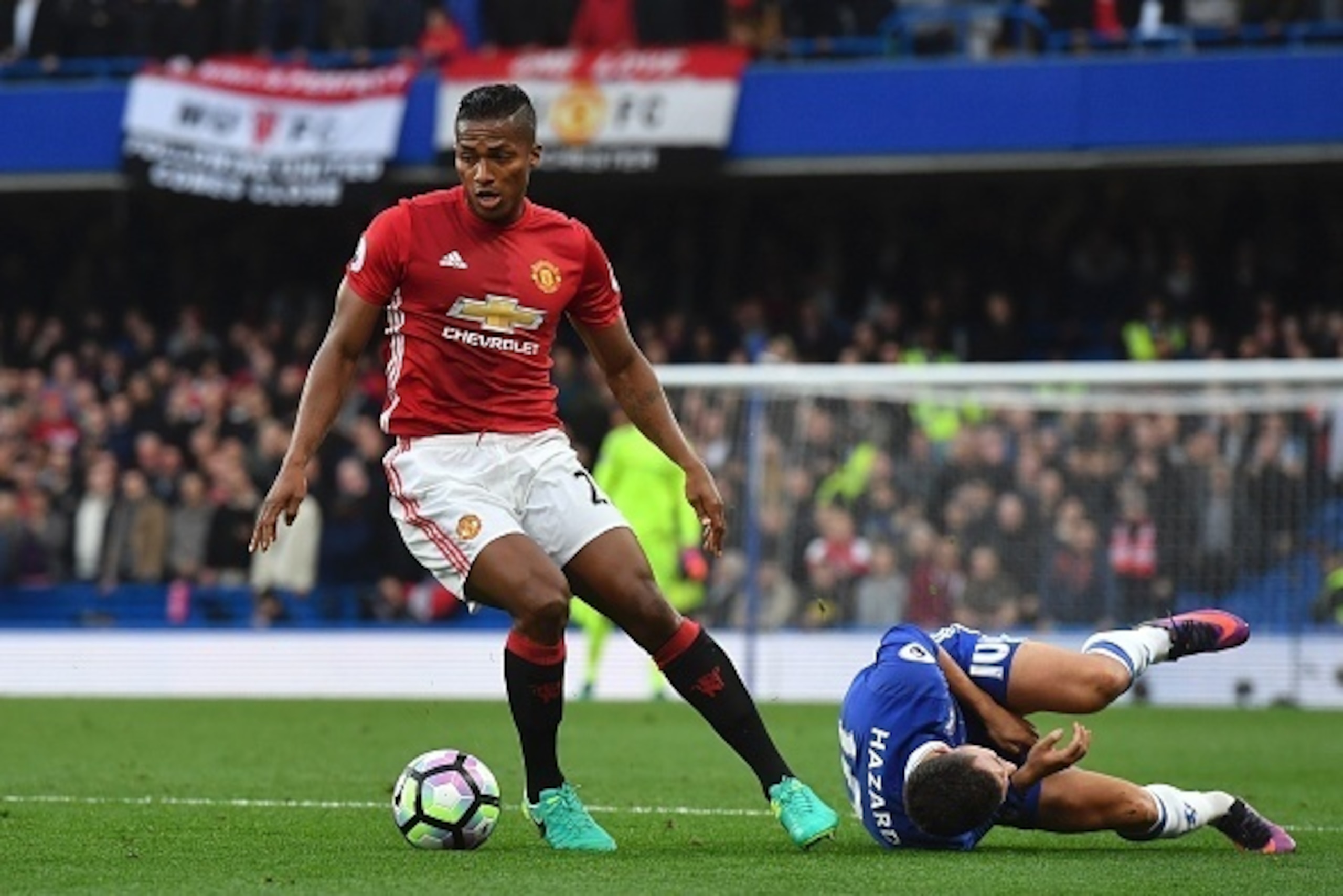 Manchester United's Ecuadorian midfielder Antonio Valencia (L) fouls Chelsea's Belgian midfielder Eden Hazard during the English Premier League football match between Chelsea and Manchester United at Stamford Bridge in London on October 23, 2016. / AFP / Manchester United's Ecuadorian midfielder Antonio Valencia (L) fouls Chelsea's Belgian midfielder Eden Hazard during the English Premier League football match between Chelsea and Manchester United at Stamford Bridge in London on October 23, 2016. / AFP /