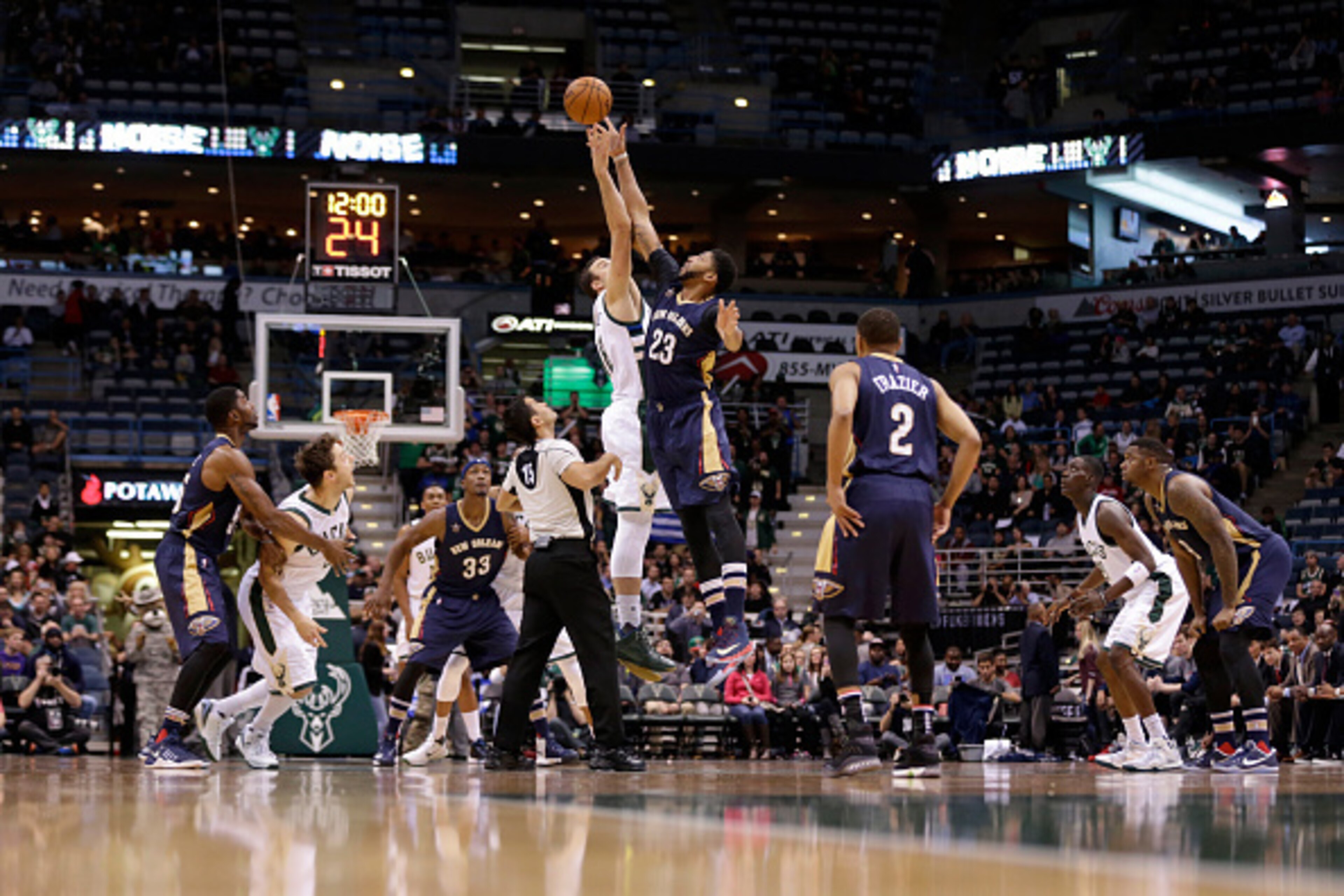 MILWAUKEE, WI - NOVEMBER 10:  Anthony Davis #23 of the New Orleans Pelicans and Miles Plumlee #18 of the Milwaukee Bucks go up for the opening tip during the game at BMO Harris Bradley Center on November 10, 2016 in Milwaukee, Wisconsin. NOTE TO USER: Use