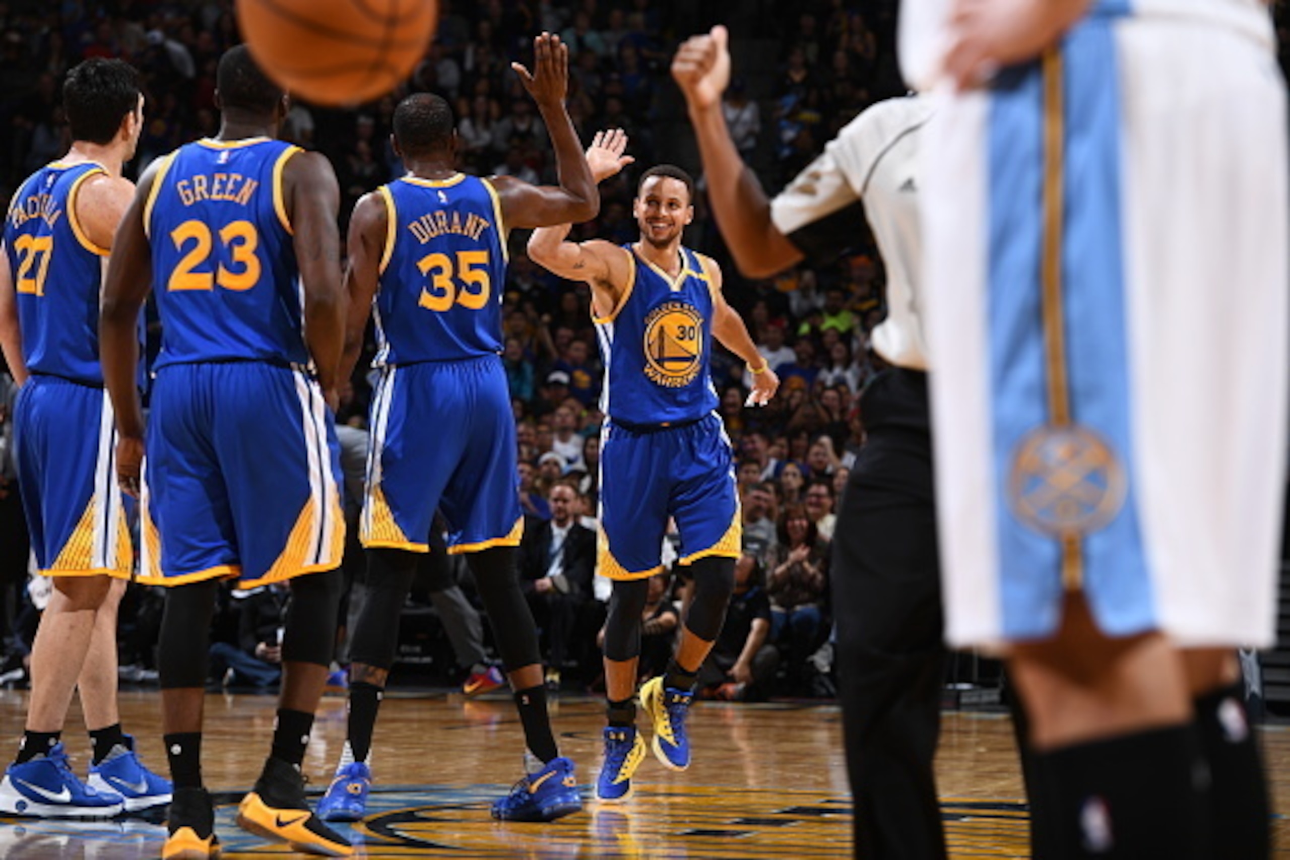 DENVER, CO - NOVEMBER 10:  Kevin Durant #35, and Stephen Curry #30 of the Golden State Warriors high five to celebrate during the game against the Denver Nuggets on November 10, 2016 at the Pepsi Center in Denver, Colorado. NOTE TO USER: User expressly ac