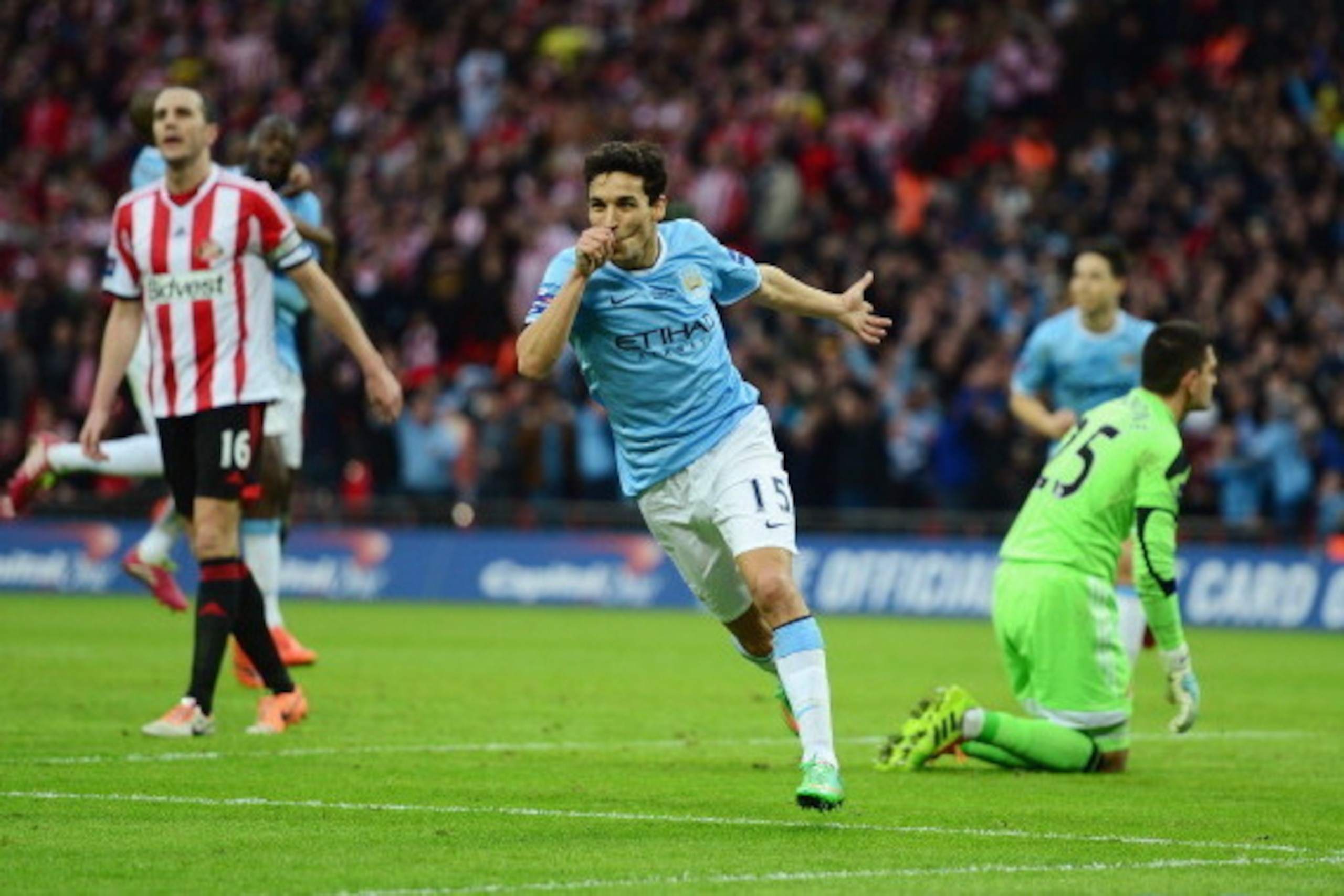 LONDON, ENGLAND - MARCH 02:  Jesus Navas of Manchester City celebrates after scoring his team's third goal during the Capital One Cup Final between Manchester City and Sunderland at Wembley Stadium on March 2, 2014 in London, England.  (Photo by Jamie McD