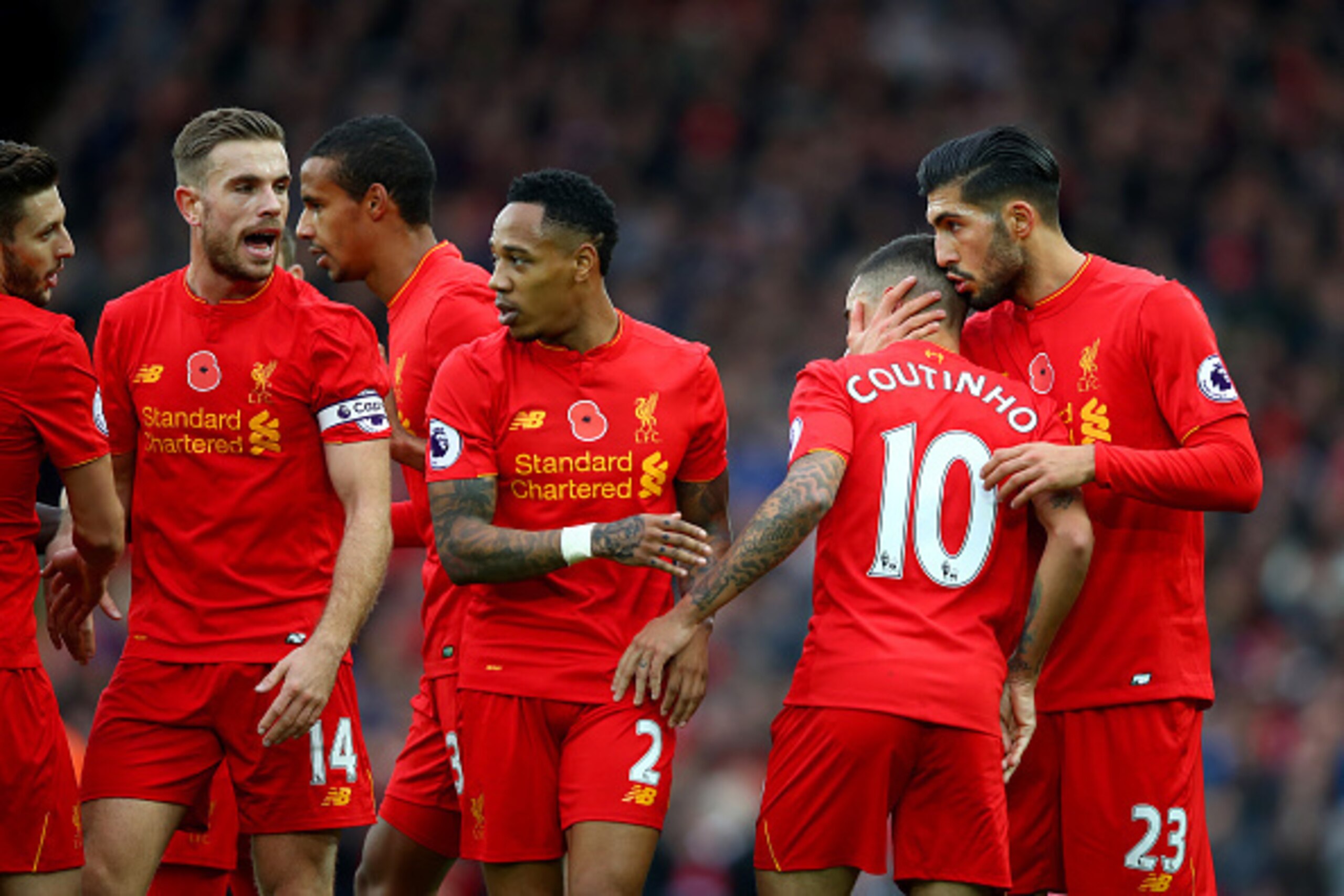 LIVERPOOL, ENGLAND - NOVEMBER 06:  Philippe Coutinho of Liverpool celebrates scoring his sides second goal with Emre Can of Liverpool and team mates during the Premier League match between Liverpool and Watford at Anfield on November 6, 2016 in Liverpool,