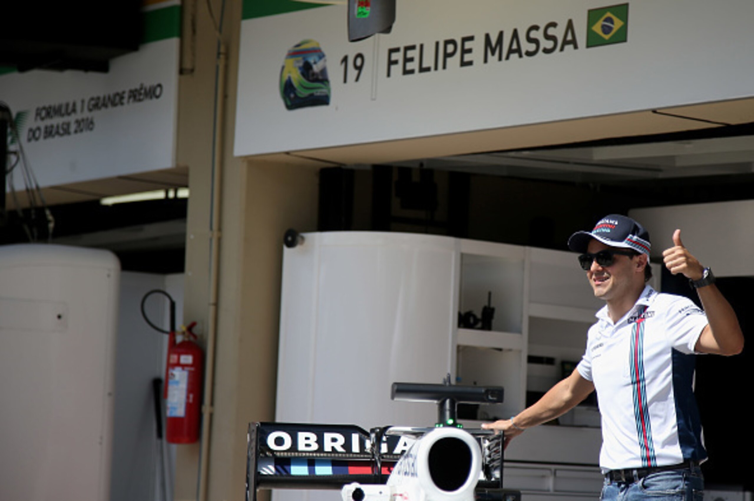 SAO PAULO, BRAZIL - NOVEMBER 10:  Felipe Massa of Brazil and Williams posses with special Martini branding on his car for his final home grand prix during previews for the Formula One Grand Prix of Brazil at Autodromo Jose Carlos Pace on November 10, 2016