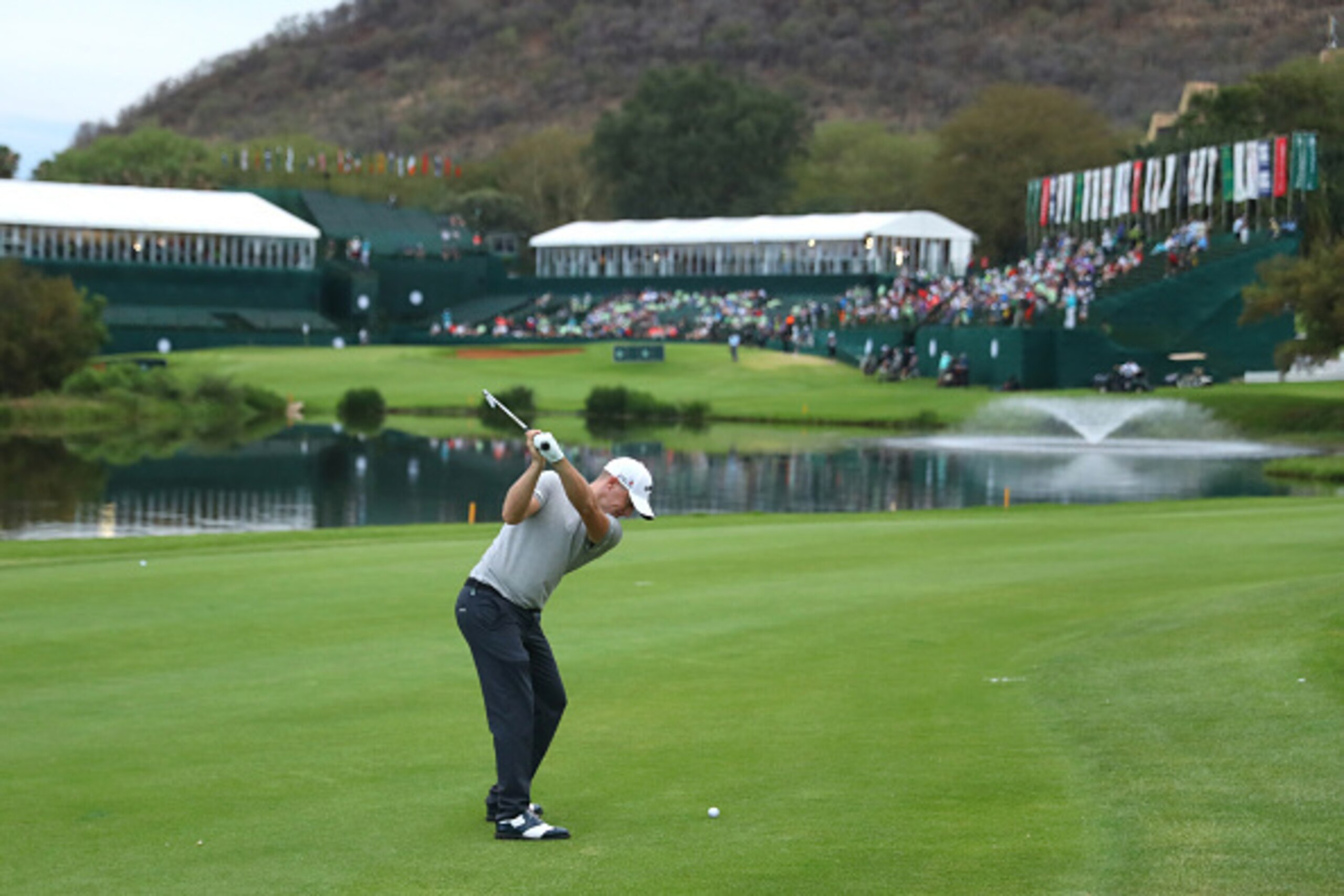 SUN CITY, SOUTH AFRICA - NOVEMBER 11:  Alex Noren of Sweden hits his second shot on the 18th hole during day two of the Nedbank Golf Challenge at Gary Player CC on November 11, 2016 in Sun City, South Africa.  (Photo by Warren Little/Getty Images)