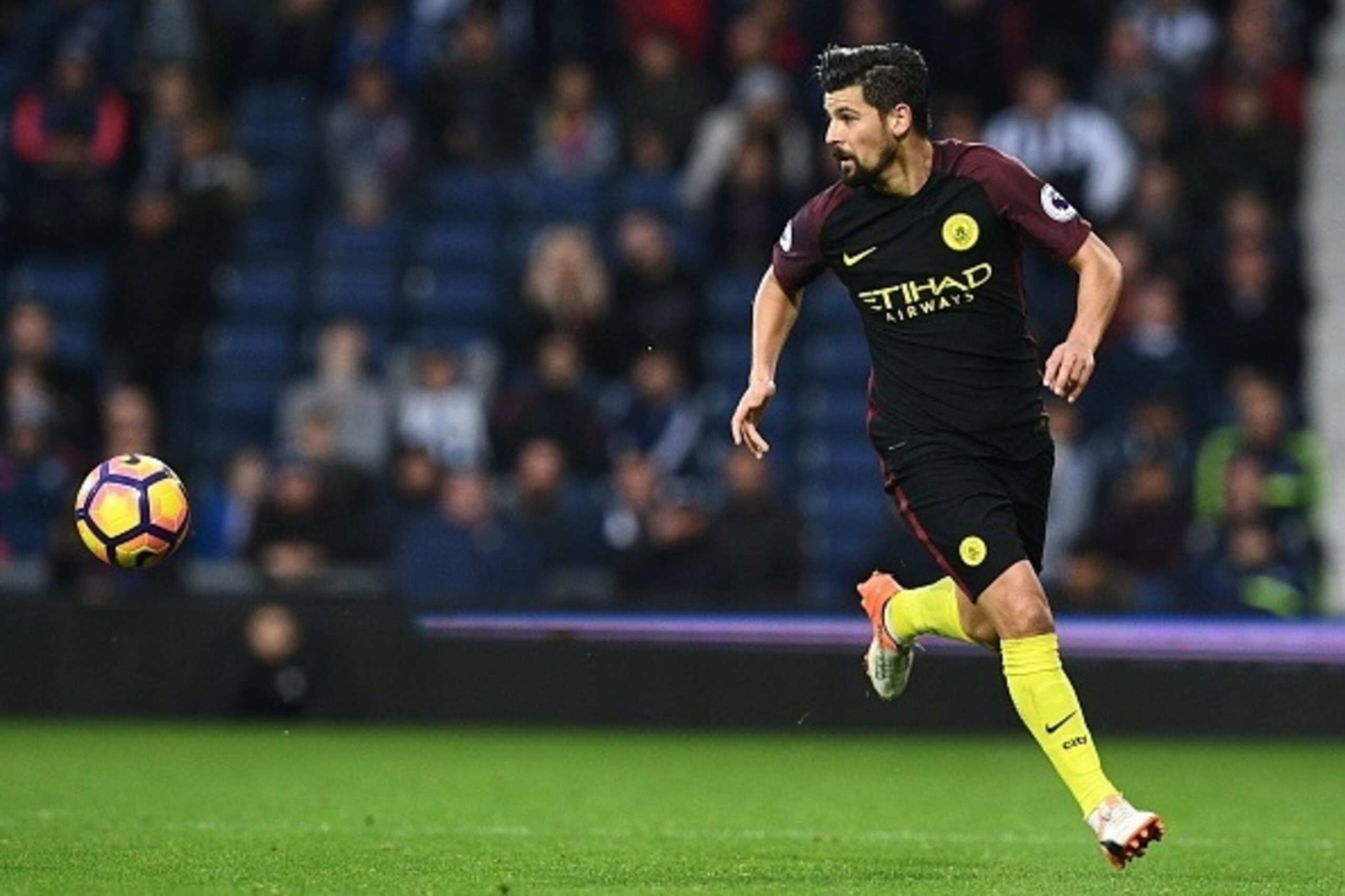 Manchester City's Spanish midfielder Nolito runs with the ball during the English Premier League football match between West Bromwich Albion and Manchester City at The Hawthorns stadium in West Bromwich, central England, on October 29, 2016.
 / AFP / Just