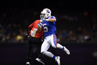 NEW ORLEANS, LA - DECEMBER 19:  Trent Taylor #5 of the Louisiana Tech Bulldogs celebrates a touchdown against the Arkansas State Red Wolves during the second quarter of the R+L Carriers New Orleans Bowl at the Mercedes-Benz Superdome on December 19, 2015