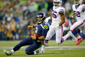 SEATTLE, WA - NOVEMBER 07:  Quarterback Russell Wilson #3 of the Seattle Seahawks slides against the Buffalo Bills at CenturyLink Field on November 7, 2016 in Seattle, Washington.  (Photo by Jonathan Ferrey/Getty Images)