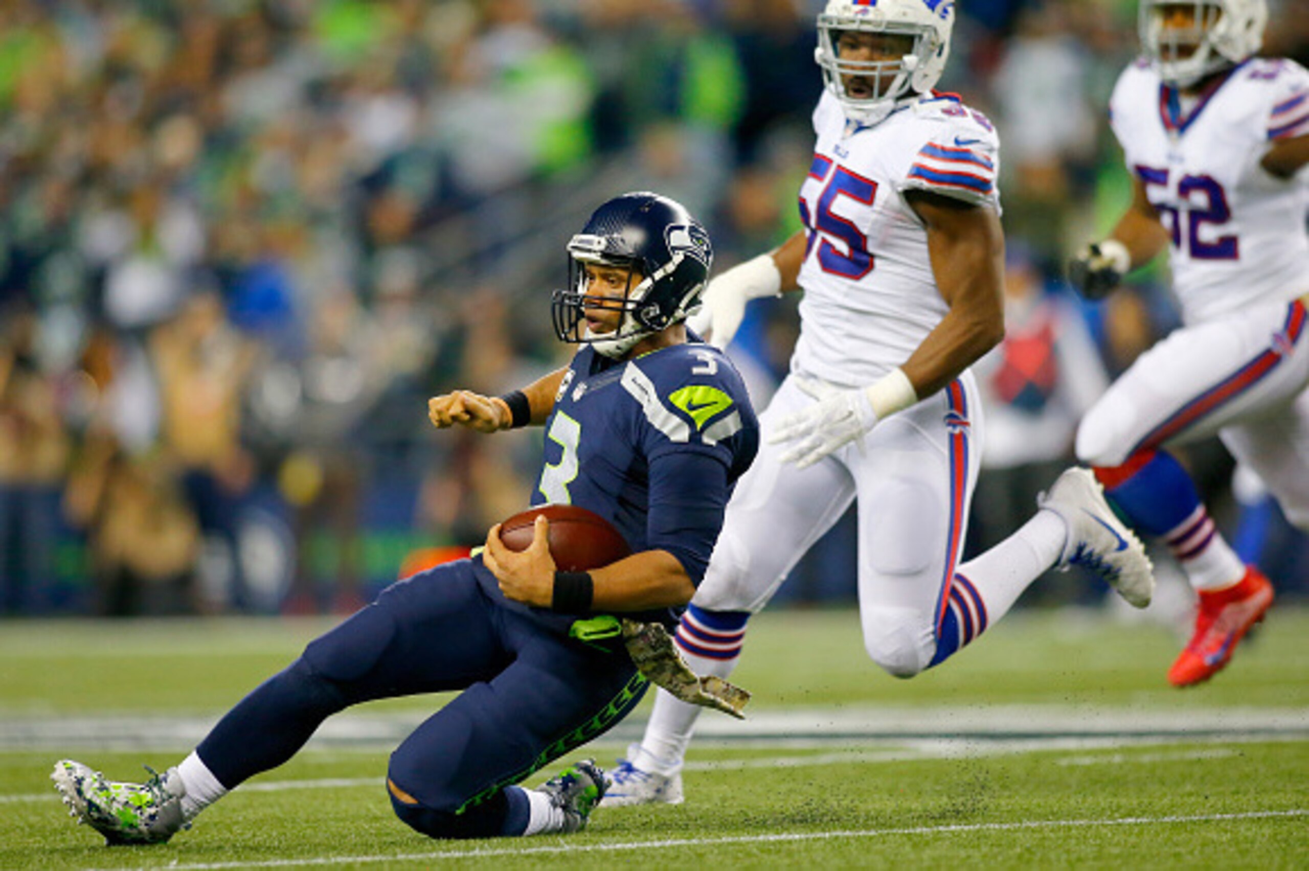 SEATTLE, WA - NOVEMBER 07:  Quarterback Russell Wilson #3 of the Seattle Seahawks slides against the Buffalo Bills at CenturyLink Field on November 7, 2016 in Seattle, Washington.  (Photo by Jonathan Ferrey/Getty Images)