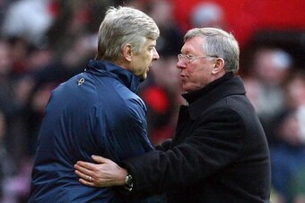Manchester United manager Sir Alex Ferguson (R) shakes hands with Arsenal manager Arsene Wenger after their English Premier League football match at Old Trafford in Manchester, north west England on April 13, 2008. United won the game 2-1. AFP PHOTO/PAUL 