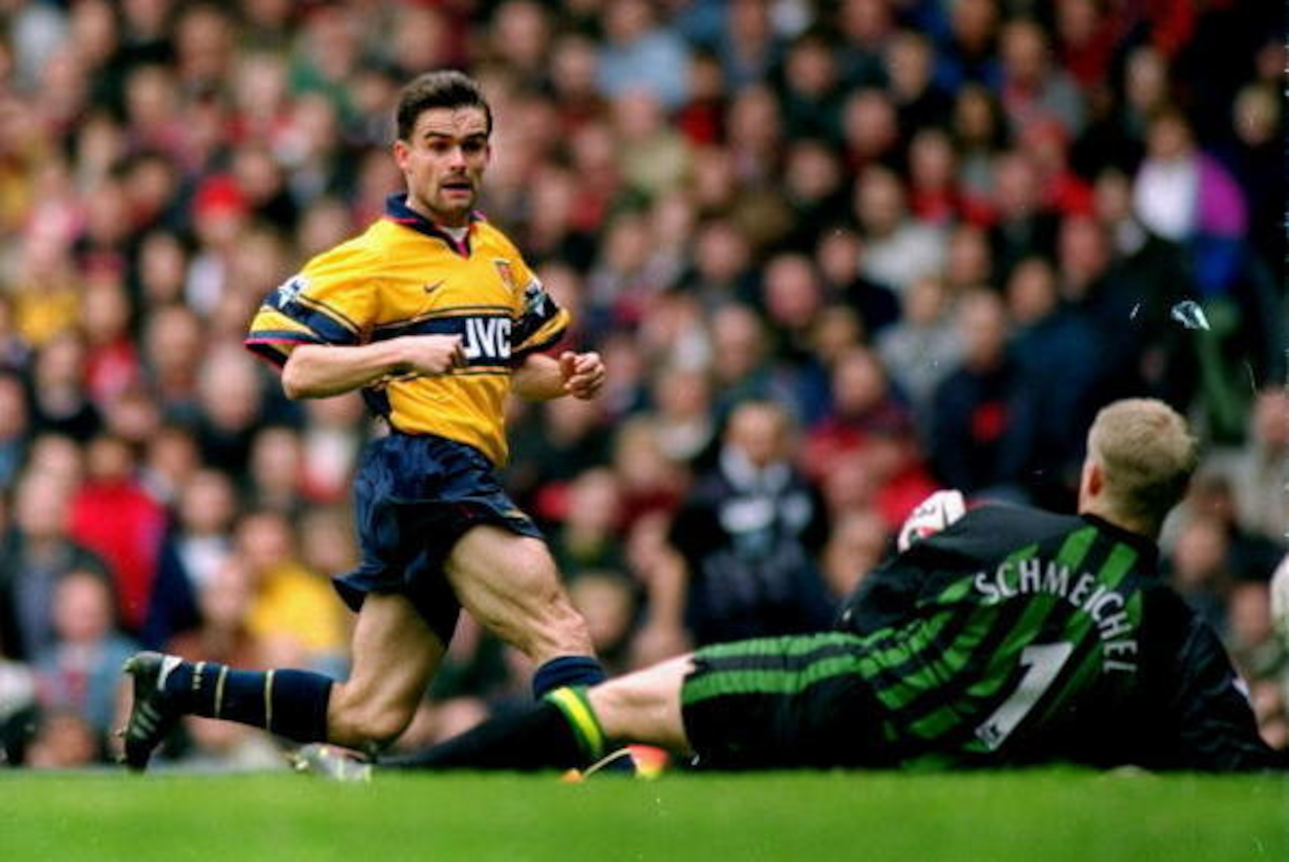 14 Mar 1998:  Marc Overmars of Arsenal scores the winner against Manchester United during the FA Carling Premiership match at Old Trafford in Manchester, England. Arsenal won 1-0. \ Mandatory Credit: Shaun Botterill /Allsport