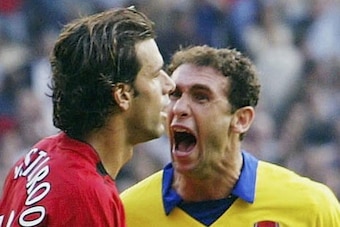 MANCHESTER, ENGLAND - SEPTEMBER 21:  Martin Keown of Arsenal shows his feelings at Ruud Van Nistelrooy of Man Utd after Van Nistelrooy missed his penalty during the FA Barclaycard Premiership match between Manchester United and Arsenal at Old Trafford on 