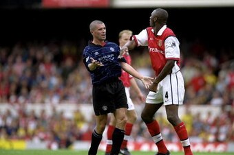 22 Aug 1999:  Roy Keane of Manchester United clashes with Patrick Vieira of Arsenal during the FA Carling Premiership match against Arsenal played at Highbury in London, England.  The match finished in a 2-1 win to Manchester United.  \ Mandatory Credit:C