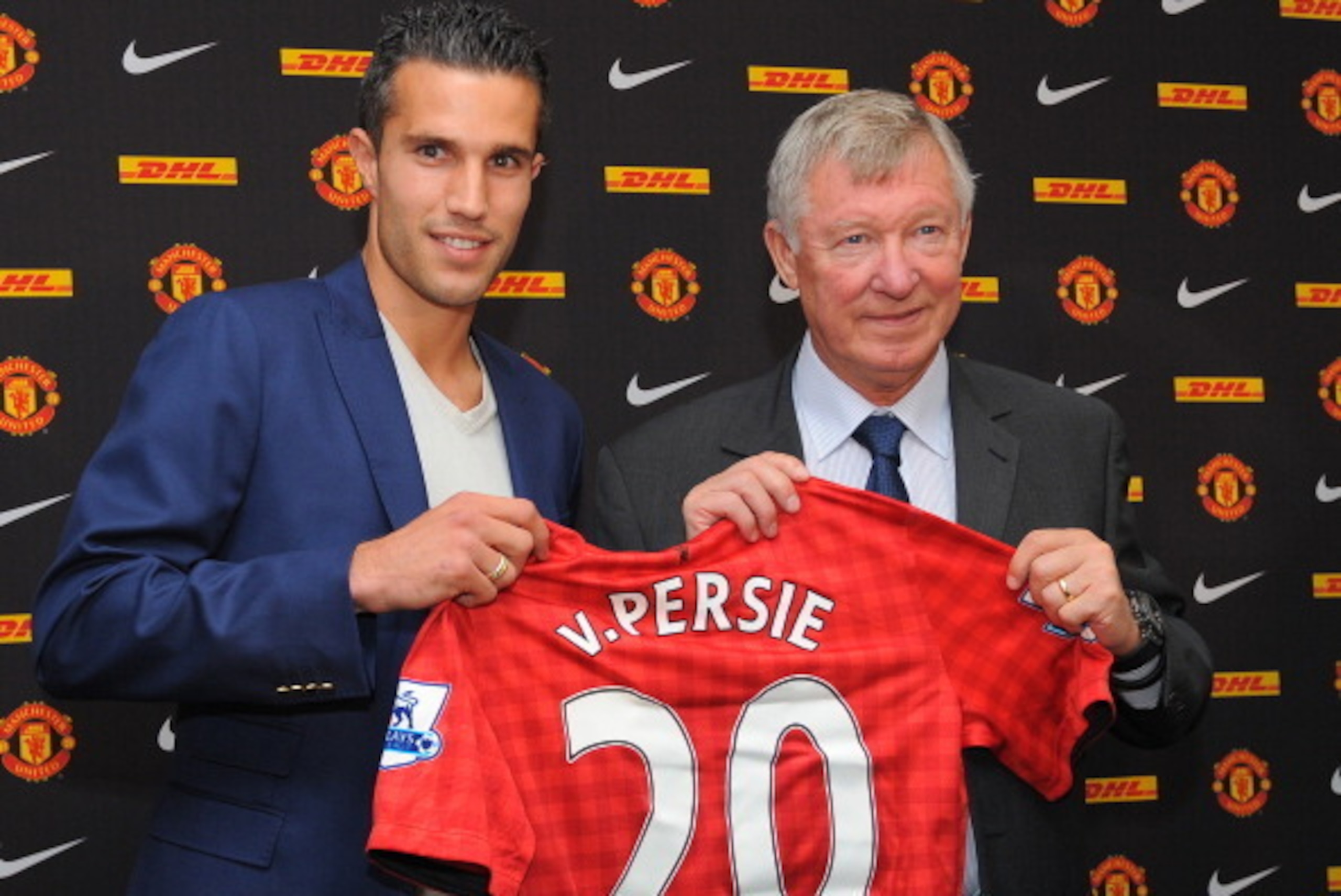 Manchester United's new signing Robin Van Persie (L) attends a press conference with Manchester United manager Alex Ferguson at Old Trafford in Manchester, north-west England on August 17, 2012. Van Persie joined United in a £24 million ($37 million, 30.6