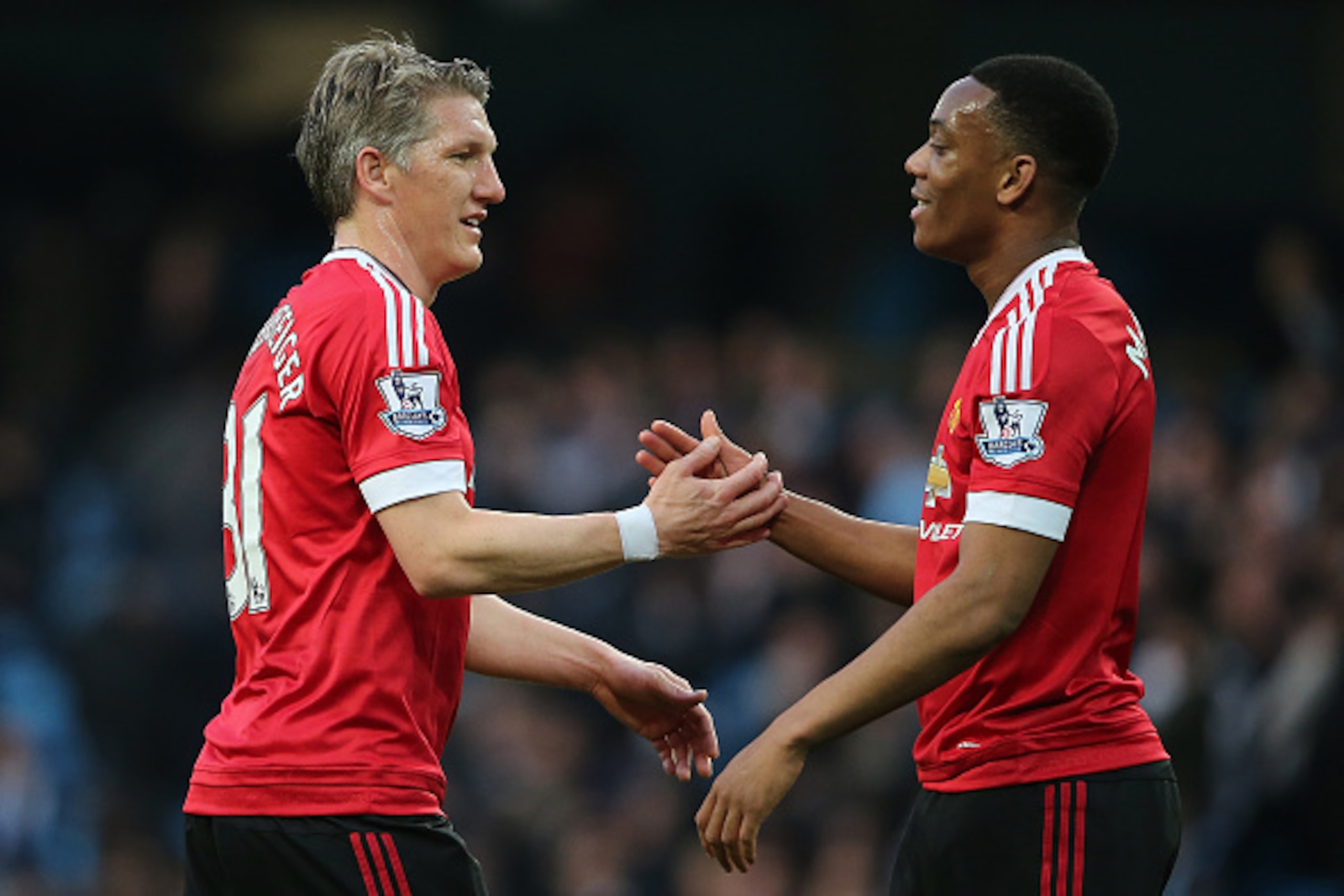 MANCHESTER, ENGLAND - MARCH 20: Bastian Schweinsteiger of Manchester United celebrates with team-mate Anthony Martial (R) at the end of the Barclays Premier League match between Manchester City and Manchester United at the Etihad Stadium on March 20, 201 MANCHESTER, ENGLAND - MARCH 20: Bastian Schweinsteiger of Manchester United celebrates with team-mate Anthony Martial (R) at the end of the Barclays Premier League match between Manchester City and Manchester United at the Etihad Stadium on March 20, 201
