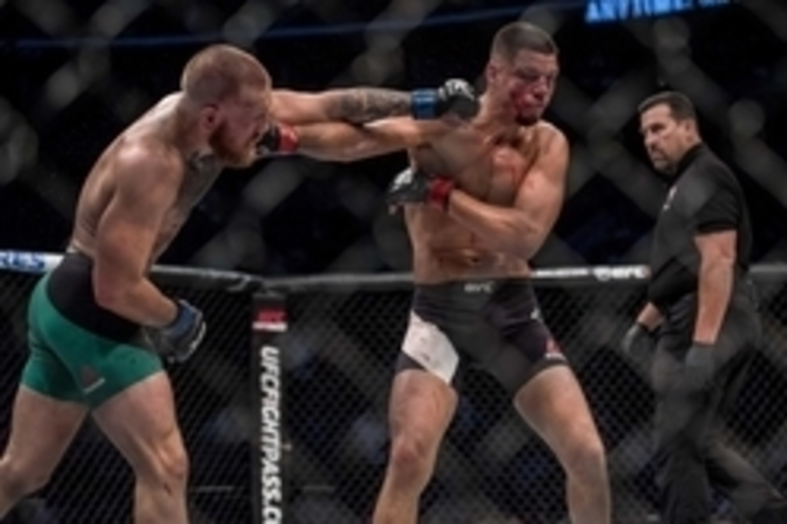 Aug 20, 2016; Las Vegas, NV, USA; Nate Diaz (red gloves) competes against Conor McGregor (blue gloves) during UFC 202 at T-Mobile Arena. Mandatory Credit: Joshua Dahl-USA TODAY Sports