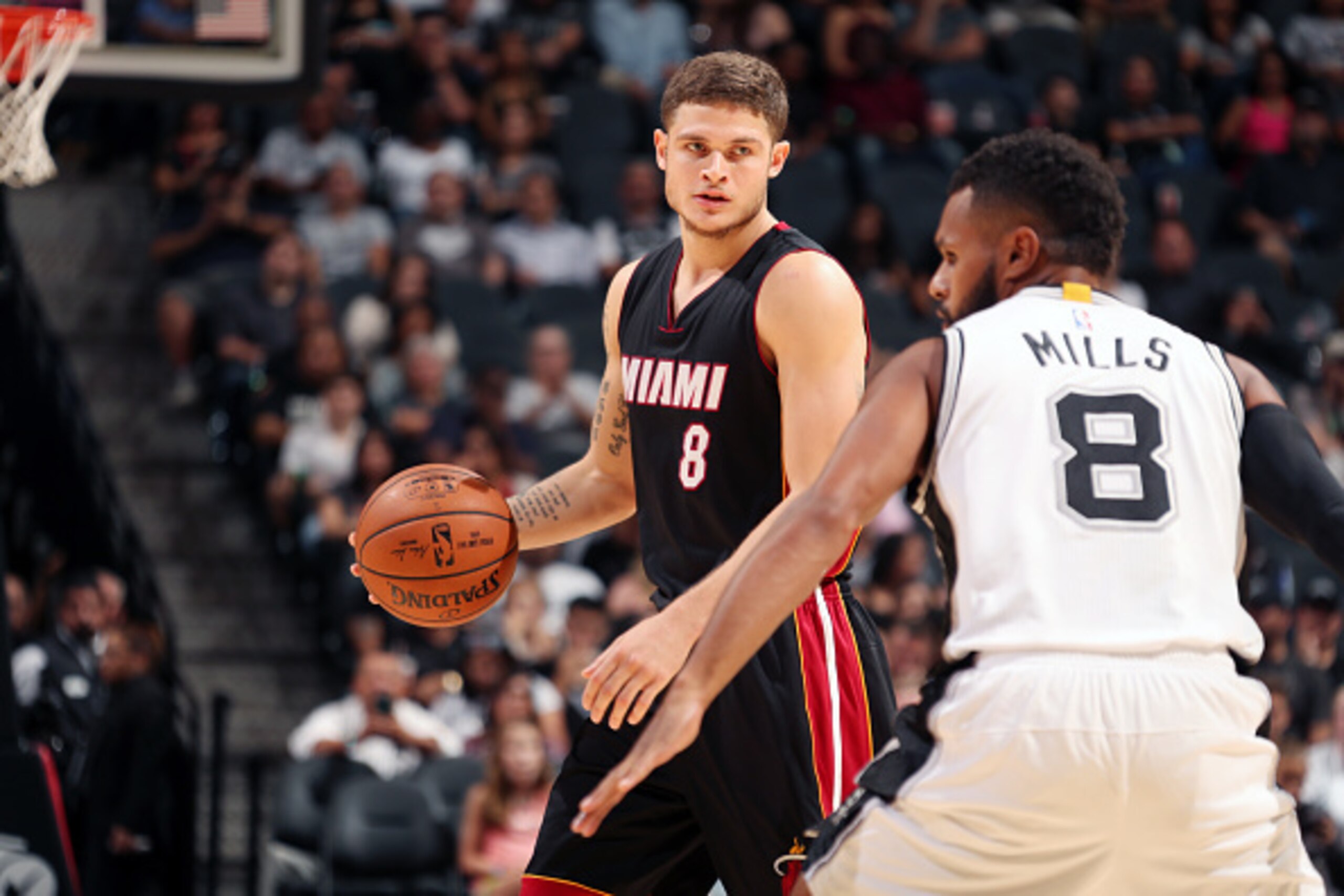 SAN ANTONIO, TX - OCTOBER 14:  Tyler Johnson #8 of the Miami Heat handles the ball against the San Antonio Spurs on October 14, 2016 at AT&T Center in San Antonio, Texas. NOTE TO USER: User expressly acknowledges and agrees that, by downloading and or usi