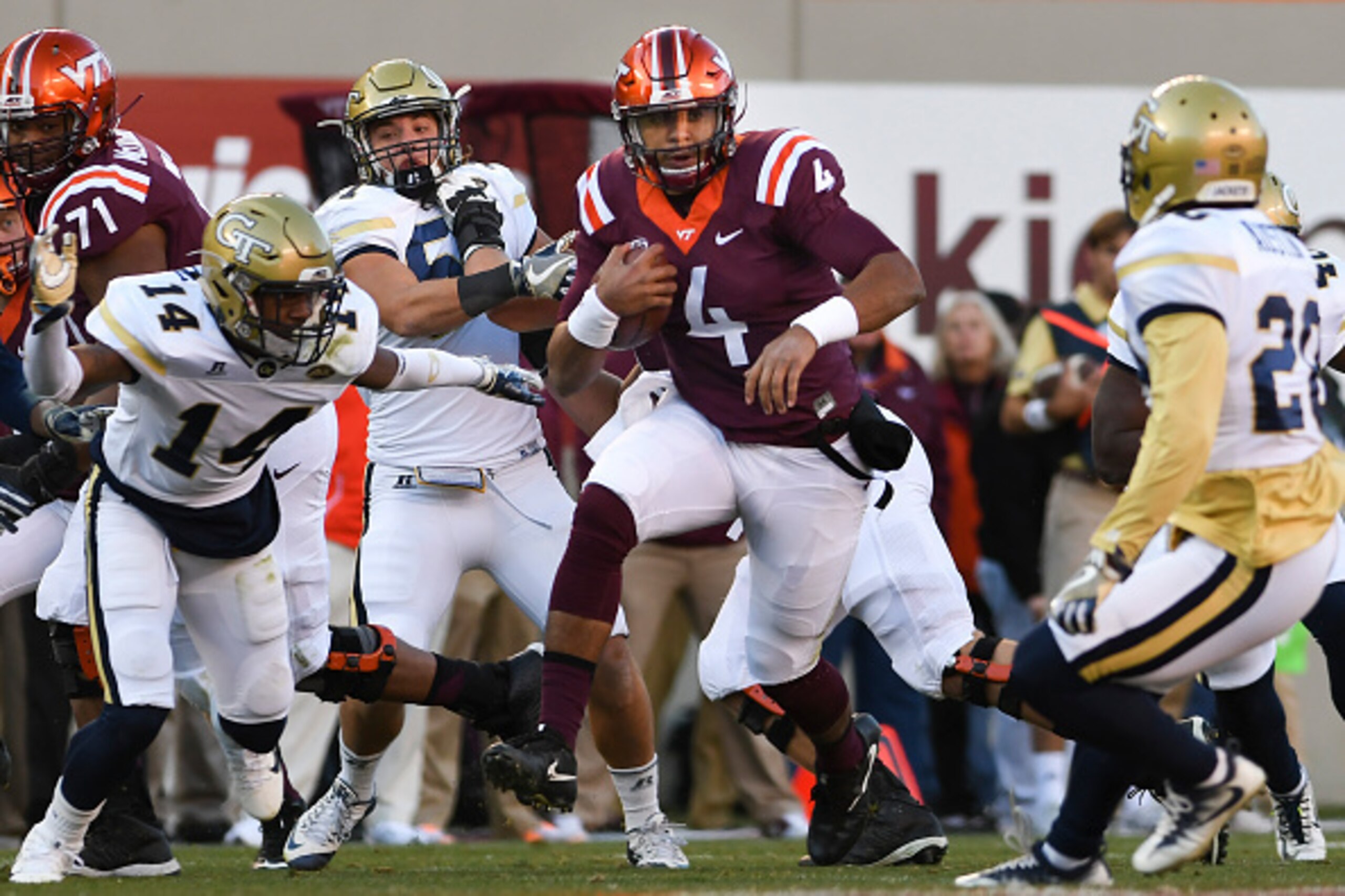 BLACKSBURG, VA - NOVEMBER 12: Quarterback Jerod Evans #4 of the Virginia Tech Hokies carries the ball against the Georgia Tech Yellow Jackets in the first half at Lane Stadium on November 12, 2016 in Blacksburg, Virginia. (Photo by Michael Shroyer/Getty I