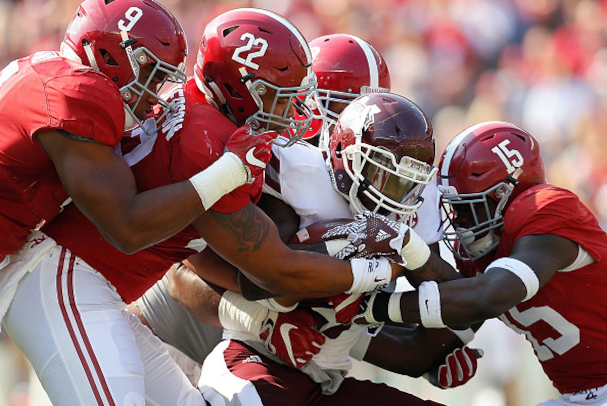 TUSCALOOSA, AL - NOVEMBER 12:  Aeris Williams #27 of the Mississippi State Bulldogs is tackled by Da'Shawn Hand #9, Ryan Anderson #22, Joshua Frazier #69 and Ronnie Harrison #15 of the Alabama Crimson Tide at Bryant-Denny Stadium on November 12, 2016 in T