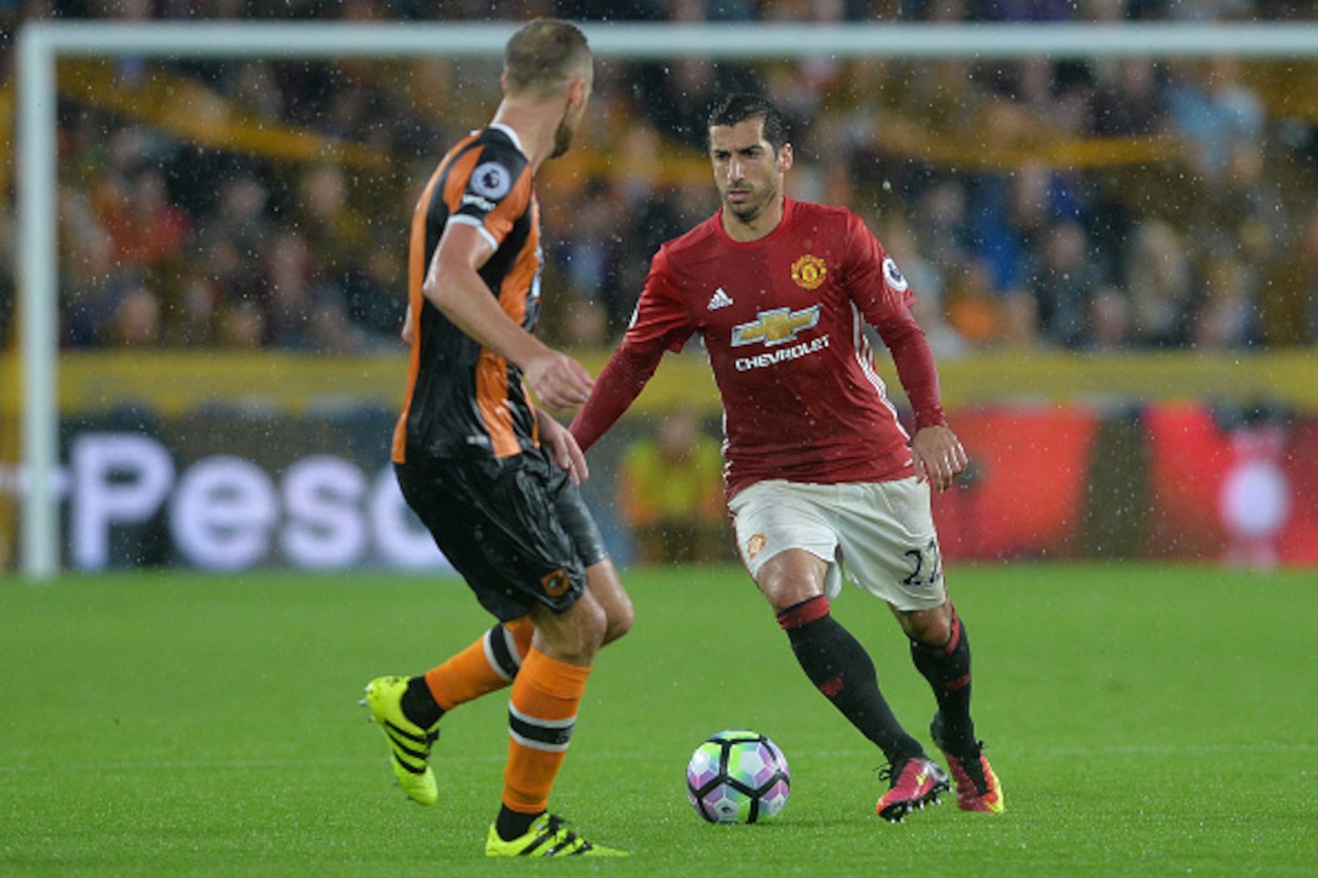 HULL, ENGLAND - AUGUST 27: Henrikh Mkhitaryan of Manchester United takes on David Meyler of Hull City during the Premier League match between Manchester United FC and Hull City FC at KC Stadium on August 27, 2016 in Hull, England. (Photo by Mark Runnacles